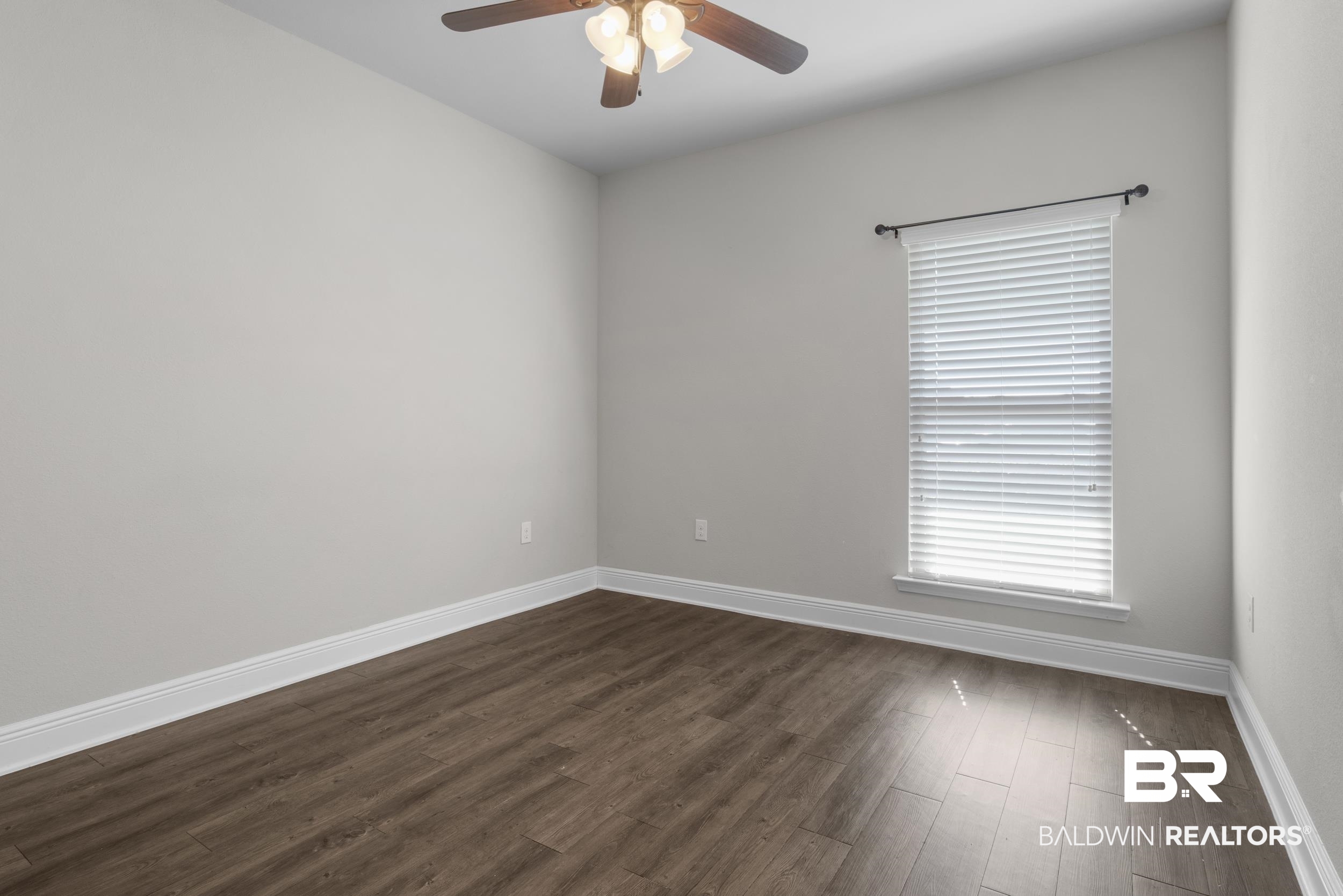 2050 Bourbon Street Foley, AL 36535 - Photo 26 of 32 Unfurnished room with ceiling fan and dark hardwood / wood-style flooring