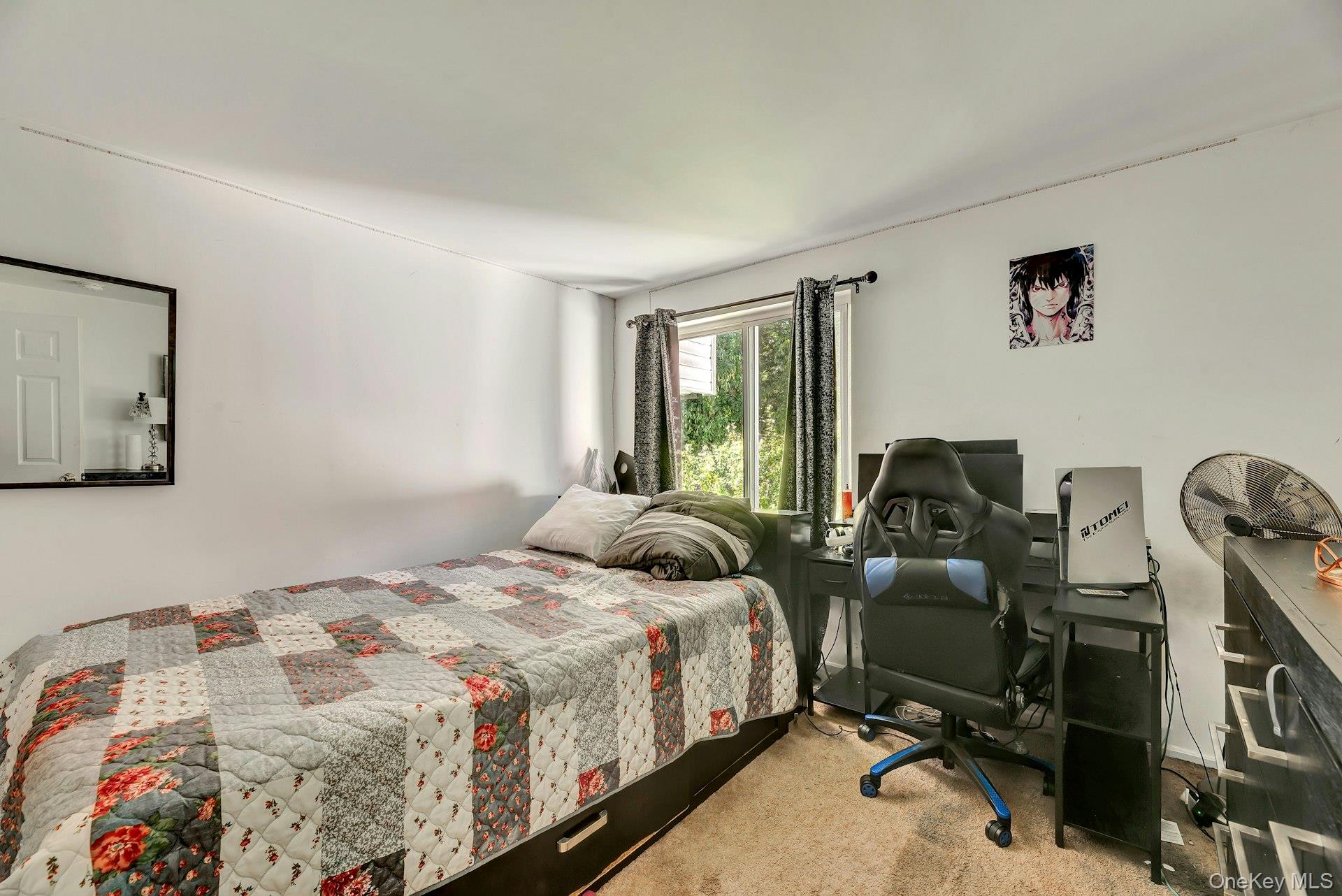 392 Birchwood Road Medford, NY 11763 - Photo 11 of 22 a bedroom with a bed and a large window