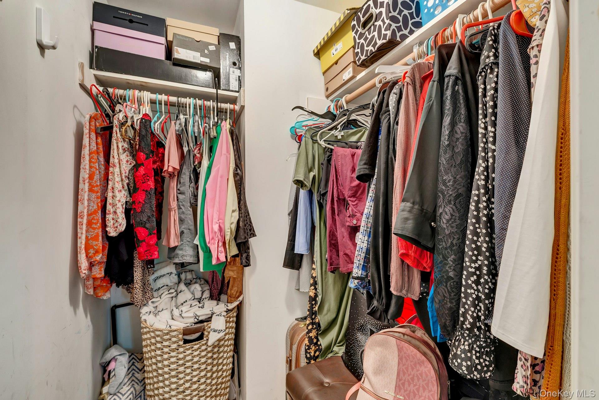 392 Birchwood Road Medford, NY 11763 - Photo 14 of 22 a view of walk in closet with clothes