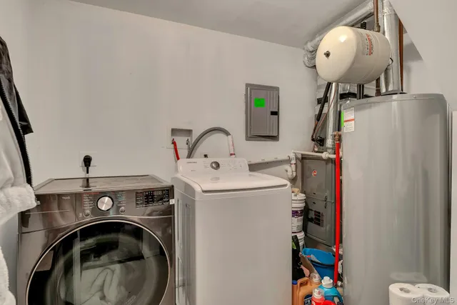a view of storage and utility room with washer and dryer