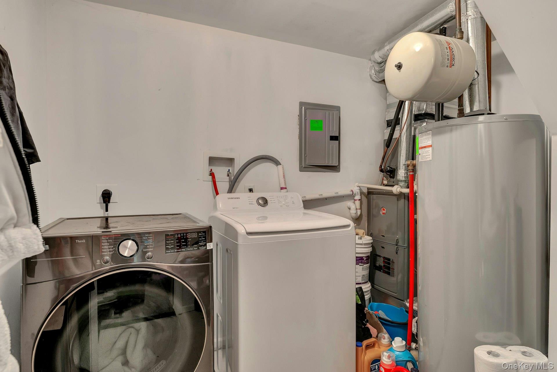 392 Birchwood Road Medford, NY 11763 - Photo 16 of 22 a view of storage and utility room with washer and dryer