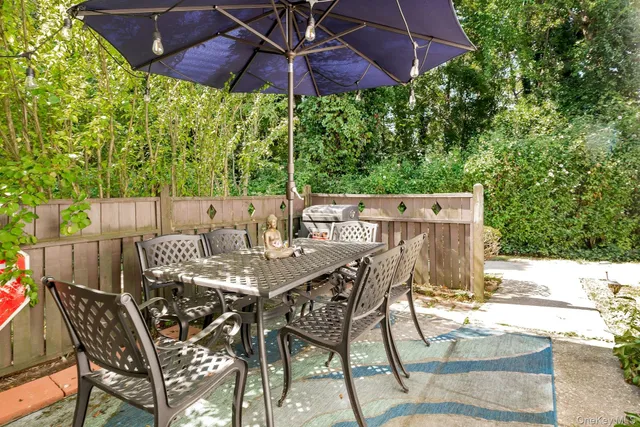 a patio with table and chairs