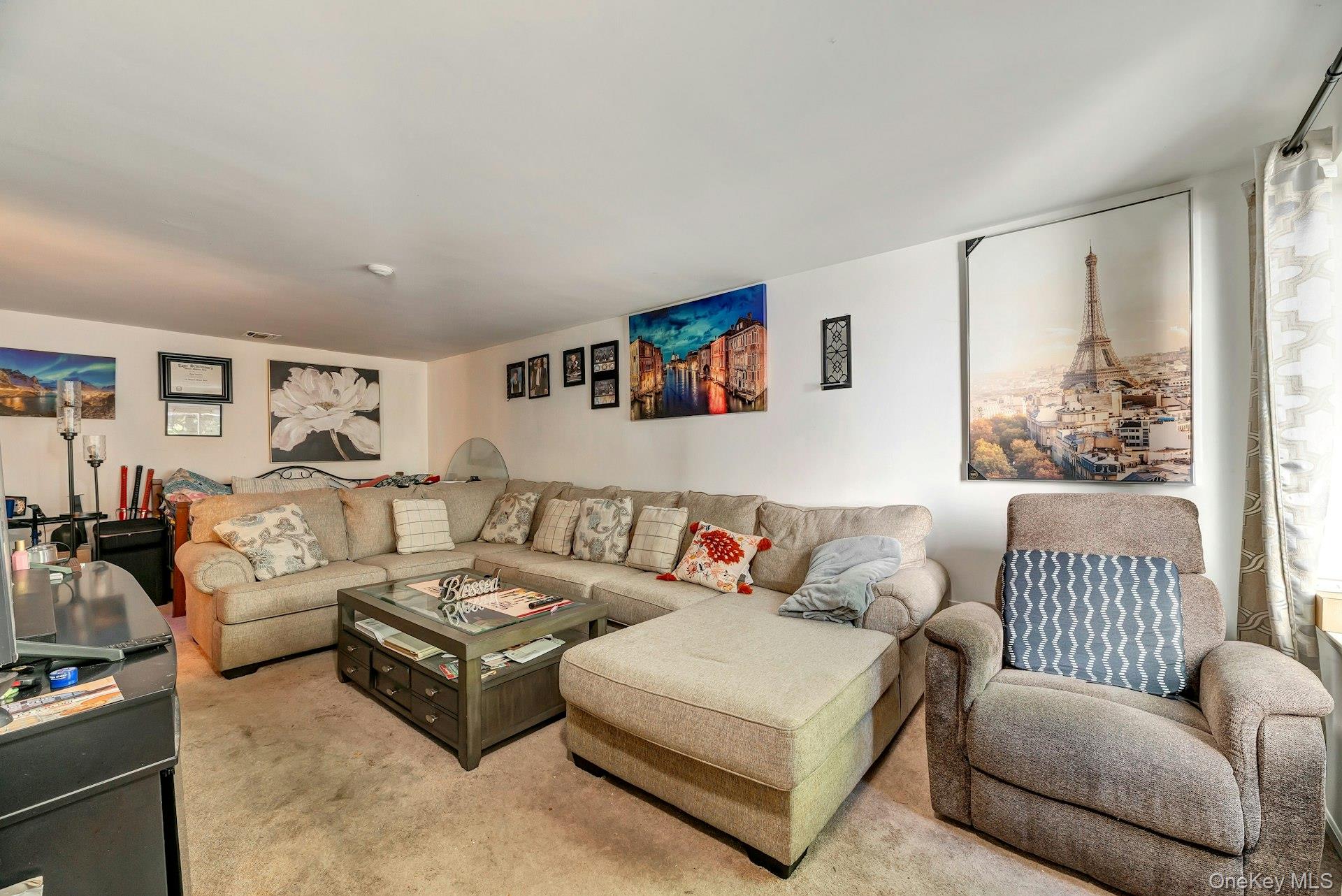 392 Birchwood Road Medford, NY 11763 - Photo 5 of 22 a living room with furniture and a large window