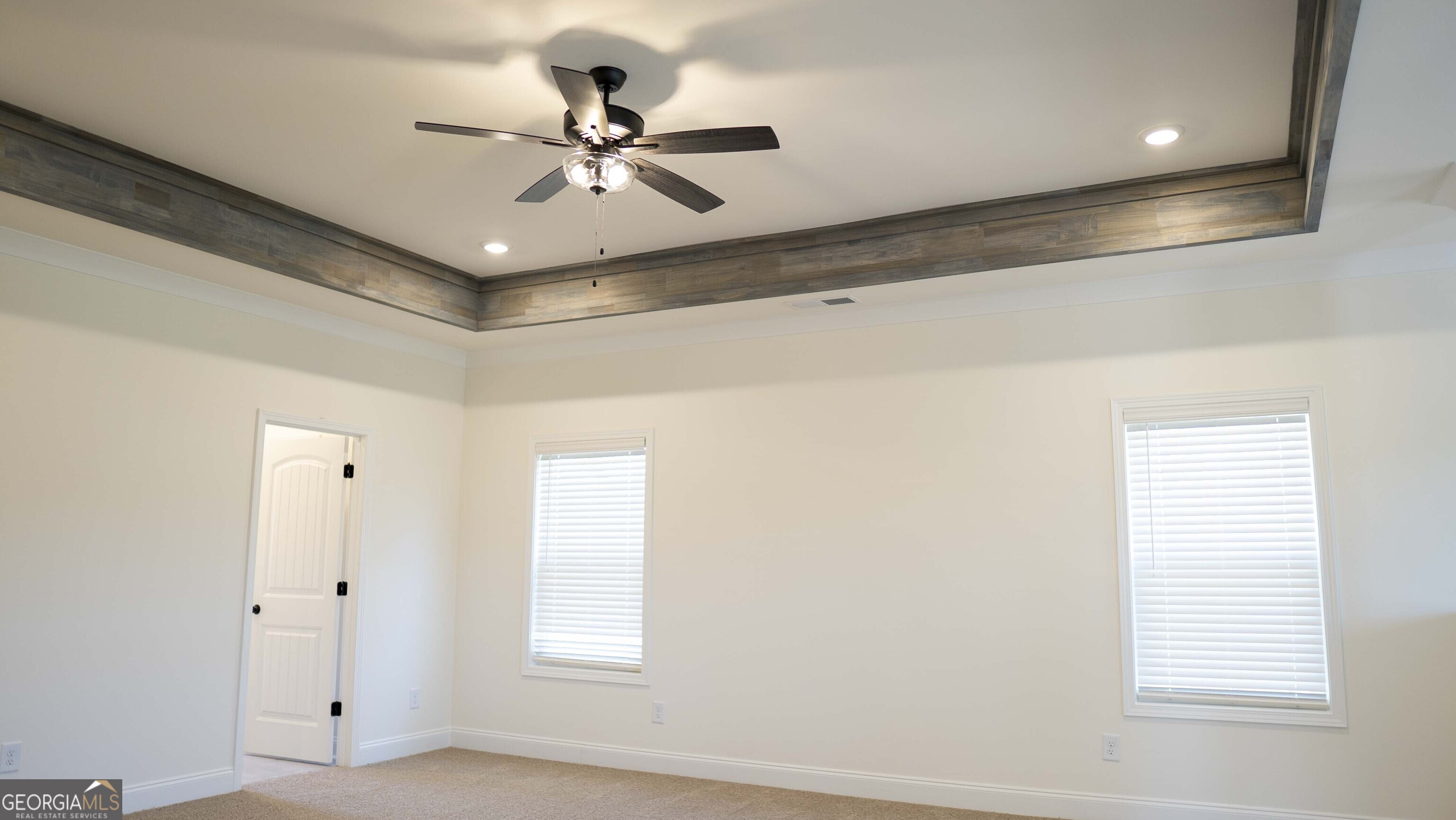 604 Beaver Court Perry, GA 31069 - Photo 19 of 40 a view of a room with a ceiling fan