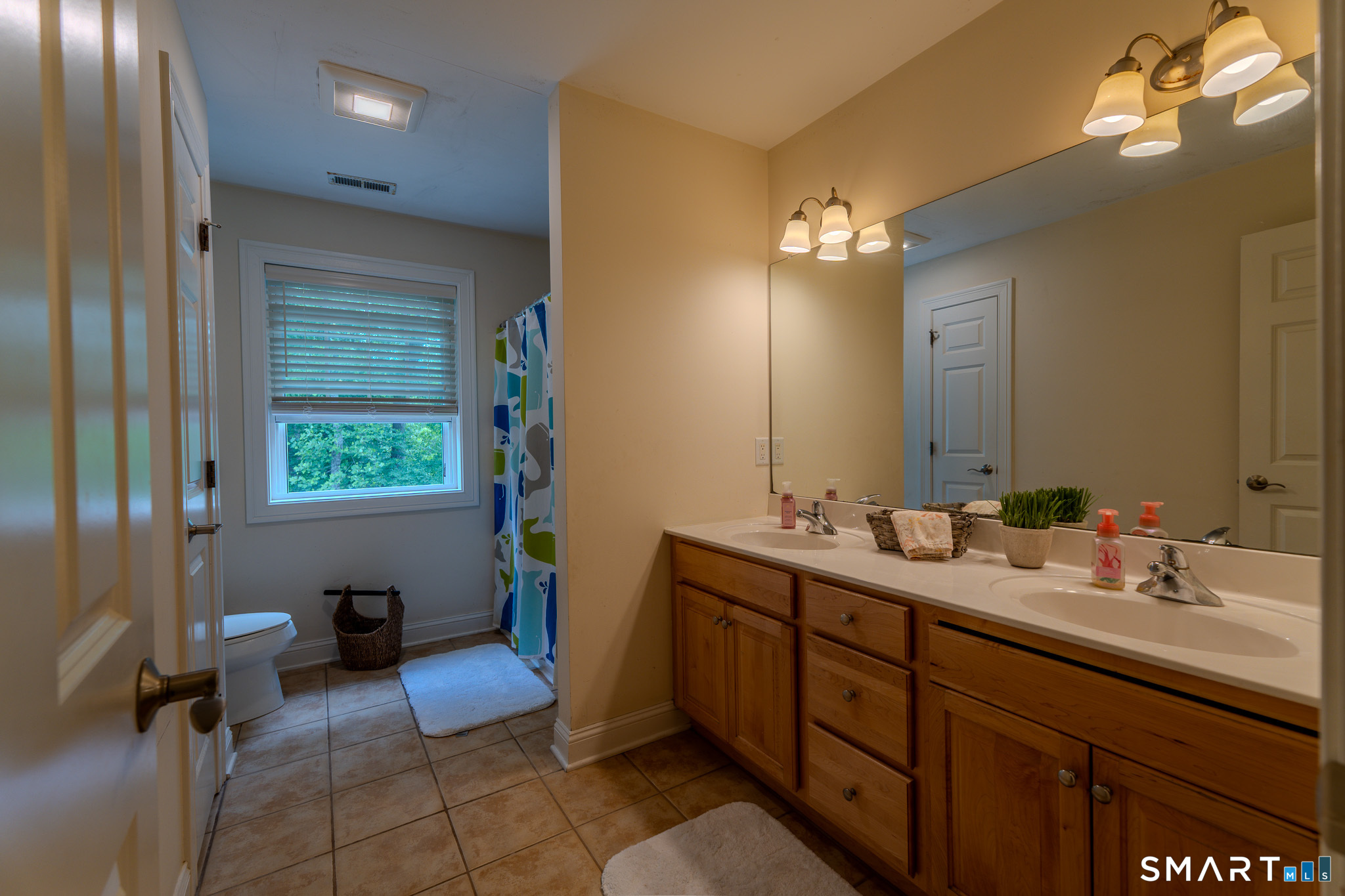 4 Ortense Road Wallingford, CT 06492 - Photo 26 of 33 a bathroom with a sink vanity and a mirror