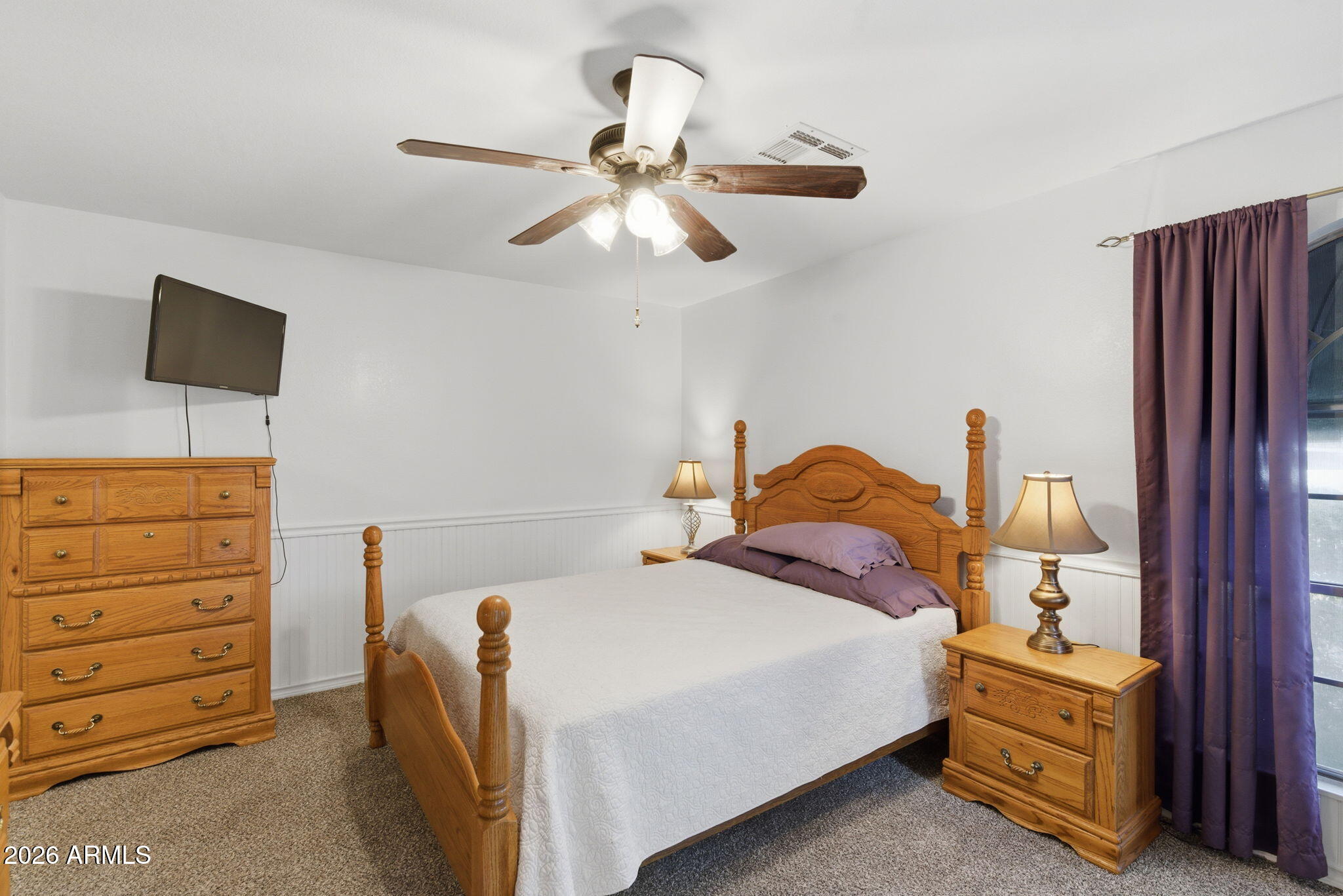 7119 West Ocotillo Road Glendale, AZ 85303 - Photo 13 of 24 a bedroom with a bed and a chandelier
