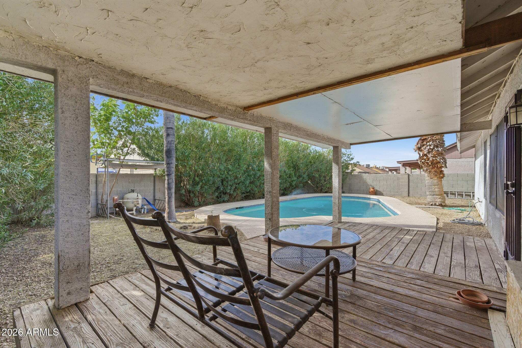 7119 West Ocotillo Road Glendale, AZ 85303 - Photo 24 of 24 a patio with yard glass top table and chairs