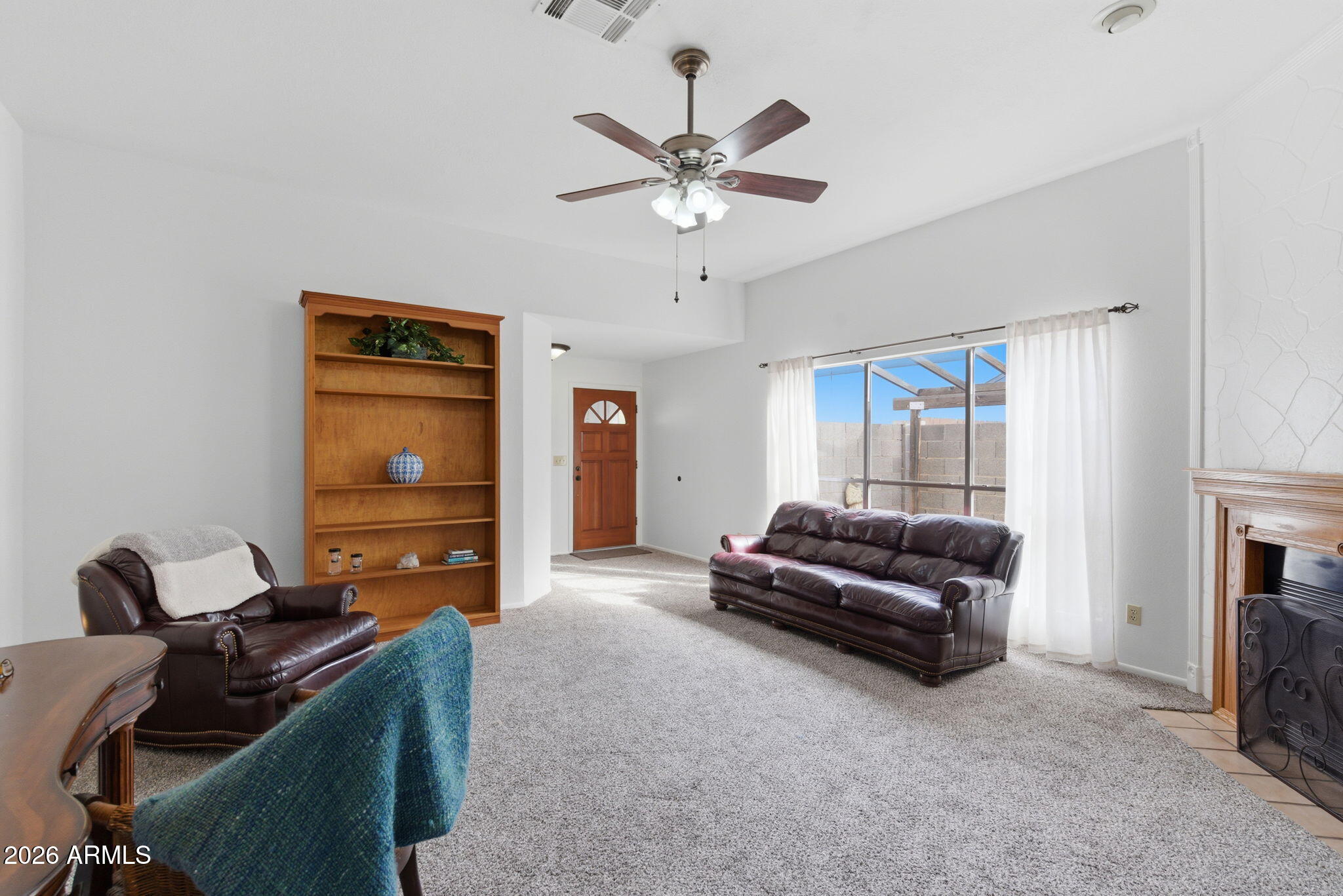 7119 West Ocotillo Road Glendale, AZ 85303 - Photo 5 of 24 a living room with furniture and a ceiling fan