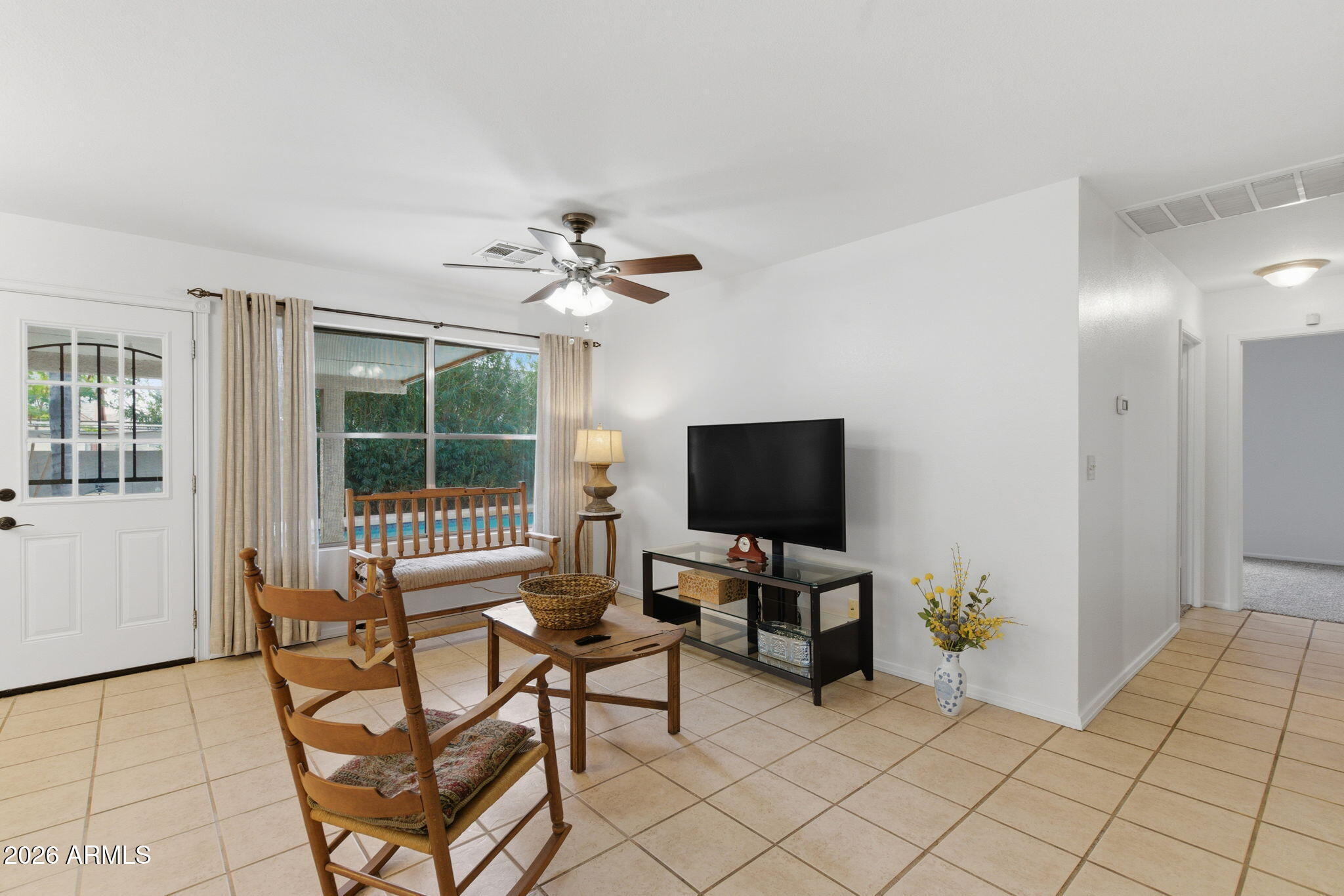 7119 West Ocotillo Road Glendale, AZ 85303 - Photo 7 of 24 a view of a livingroom with furniture and a flat screen tv
