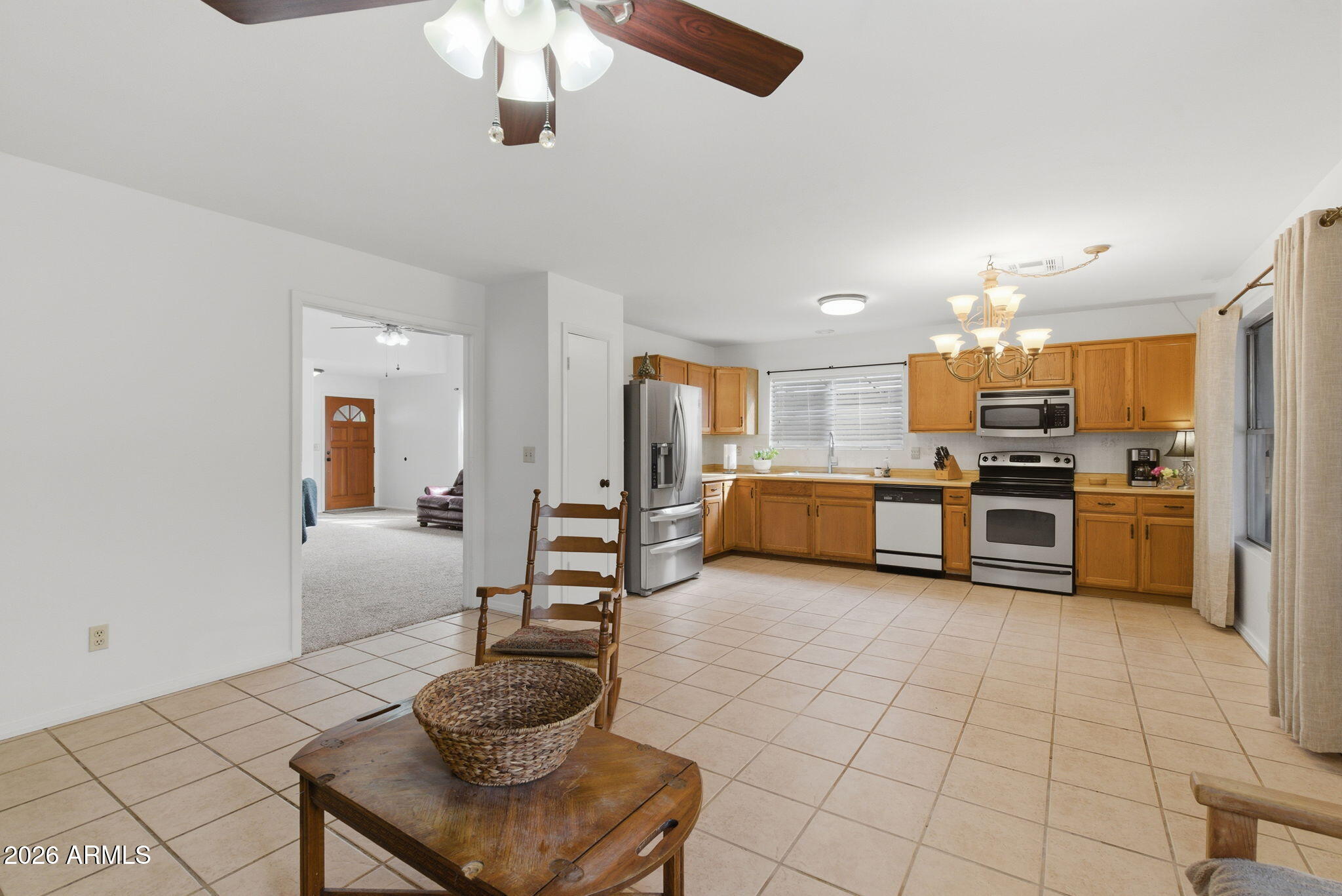 7119 West Ocotillo Road Glendale, AZ 85303 - Photo 8 of 24 a kitchen with stainless steel appliances kitchen island granite countertop a sink and cabinets