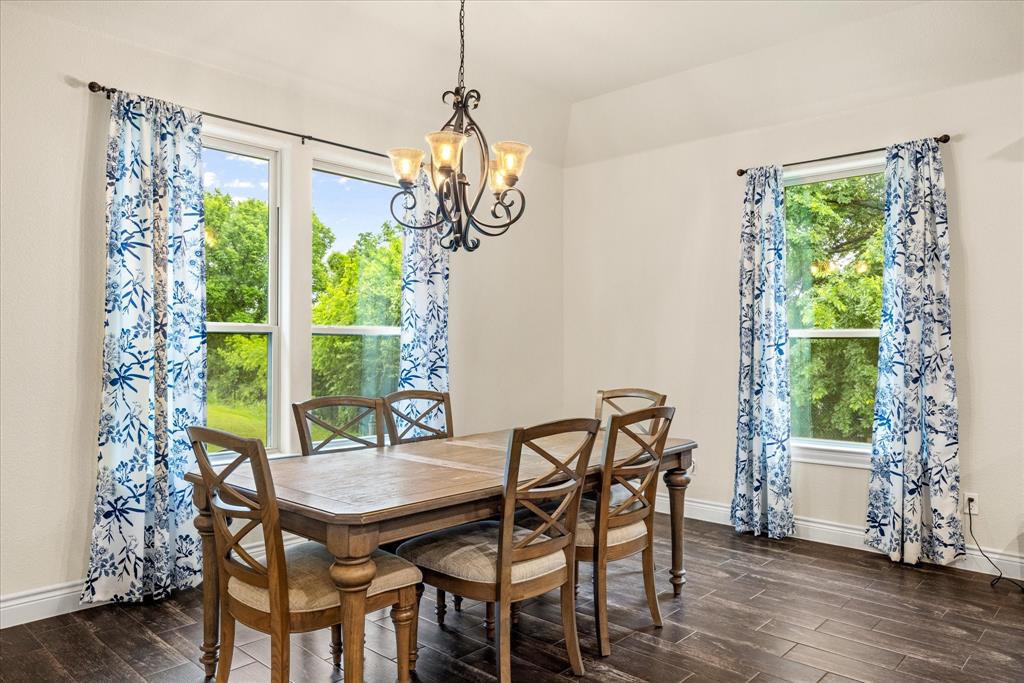 100 Knob Road Springtown, TX 76082 - Photo 11 of 29 a view of a dining room with furniture window and wooden floor