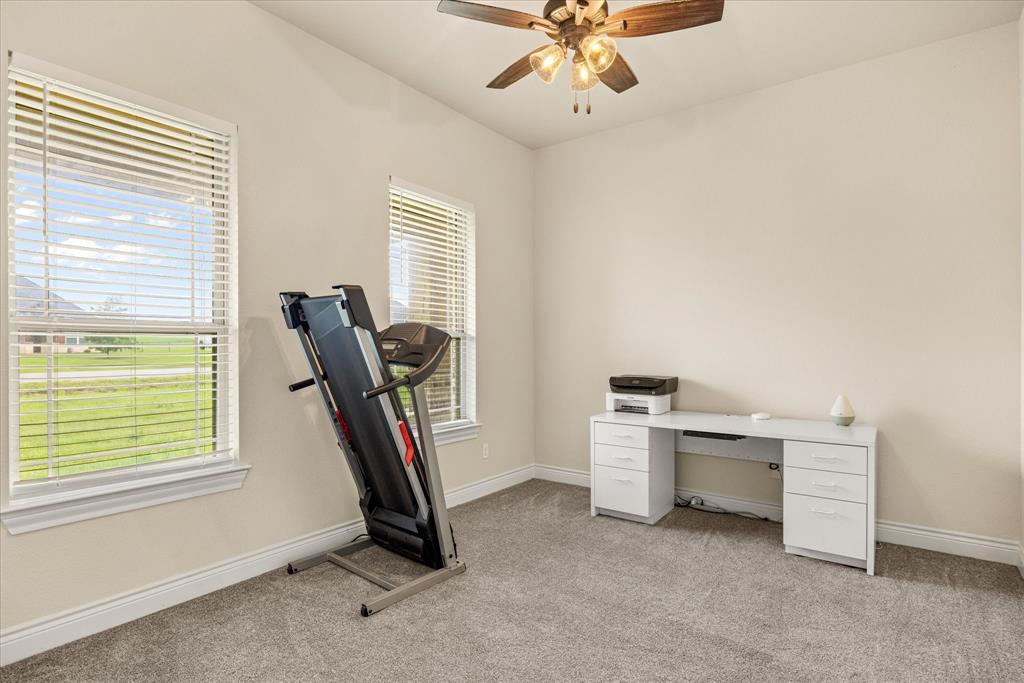 100 Knob Road Springtown, TX 76082 - Photo 17 of 29 a view of a room with gym equipment