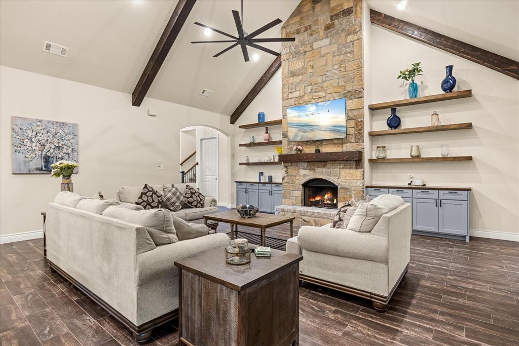 100 Knob Road Springtown, TX 76082 - Photo 4 of 29 a living room with furniture fireplace and wooden floor