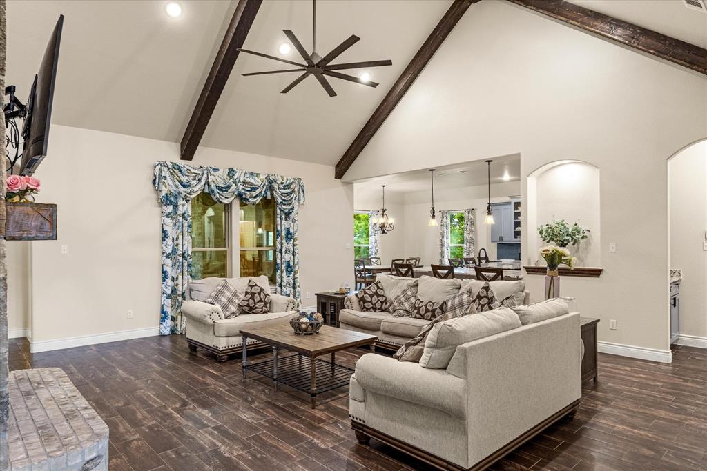 100 Knob Road Springtown, TX 76082 - Photo 5 of 29 a living room with furniture and wooden floor