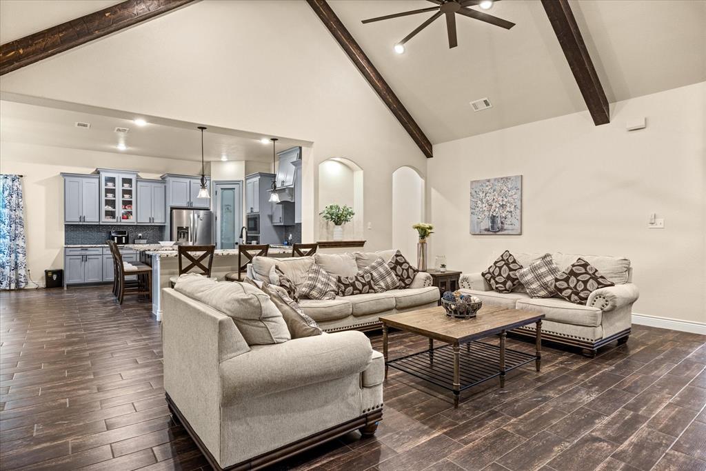 100 Knob Road Springtown, TX 76082 - Photo 7 of 29 a living room with furniture and a view of kitchen