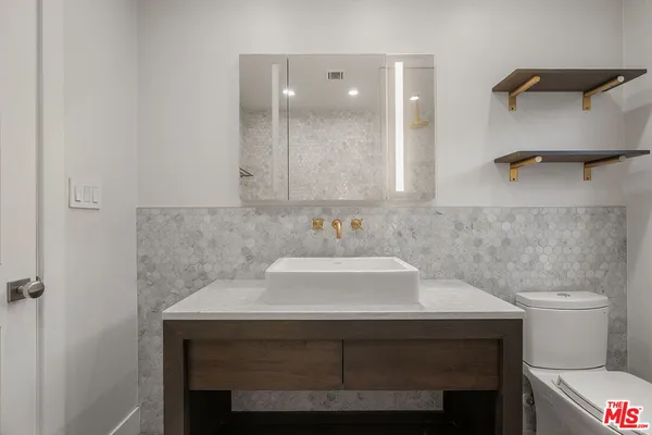 a bathroom with a sink and a toilet