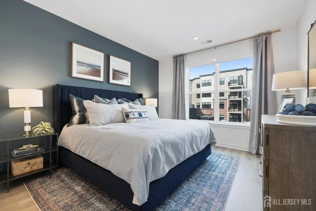 a bedroom with bed and a window