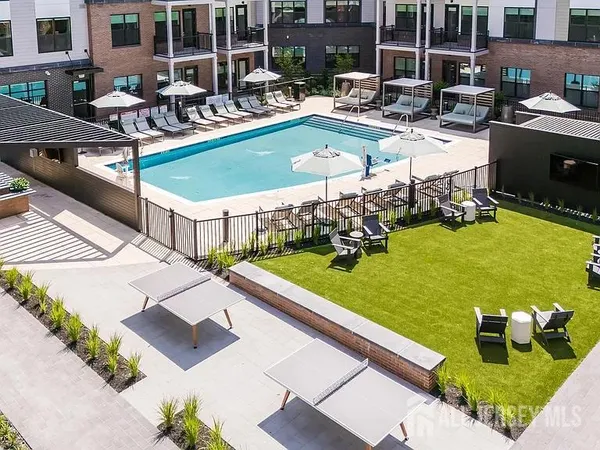 a view of a swimming pool with chairs