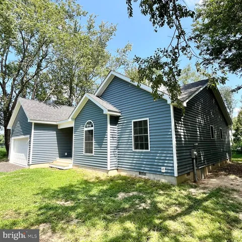 a house with trees in the background
