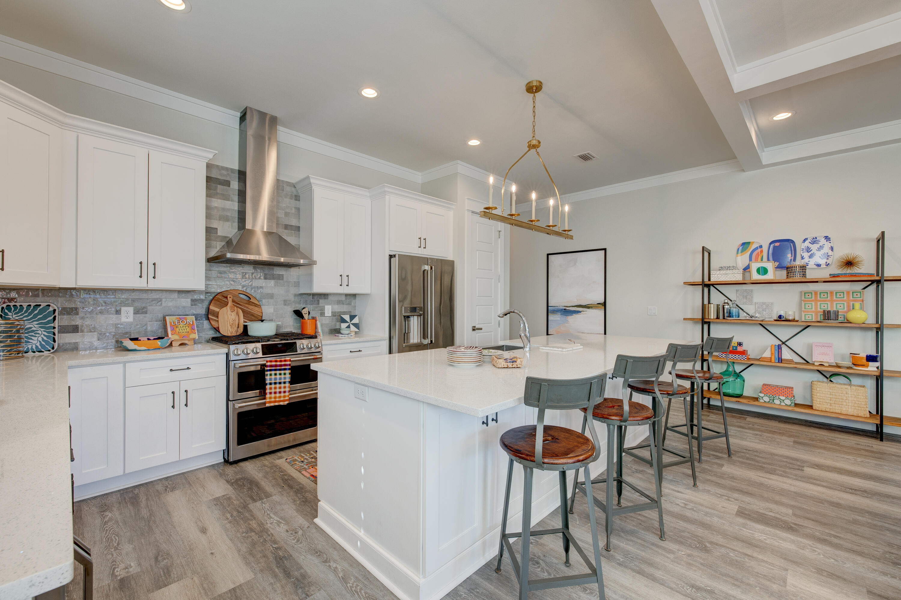 34 Gulfview Way Santa Rosa Beach, FL 32459 - Photo 13 of 54 a kitchen with stainless steel appliances kitchen island granite countertop a table chairs and a refrigerator