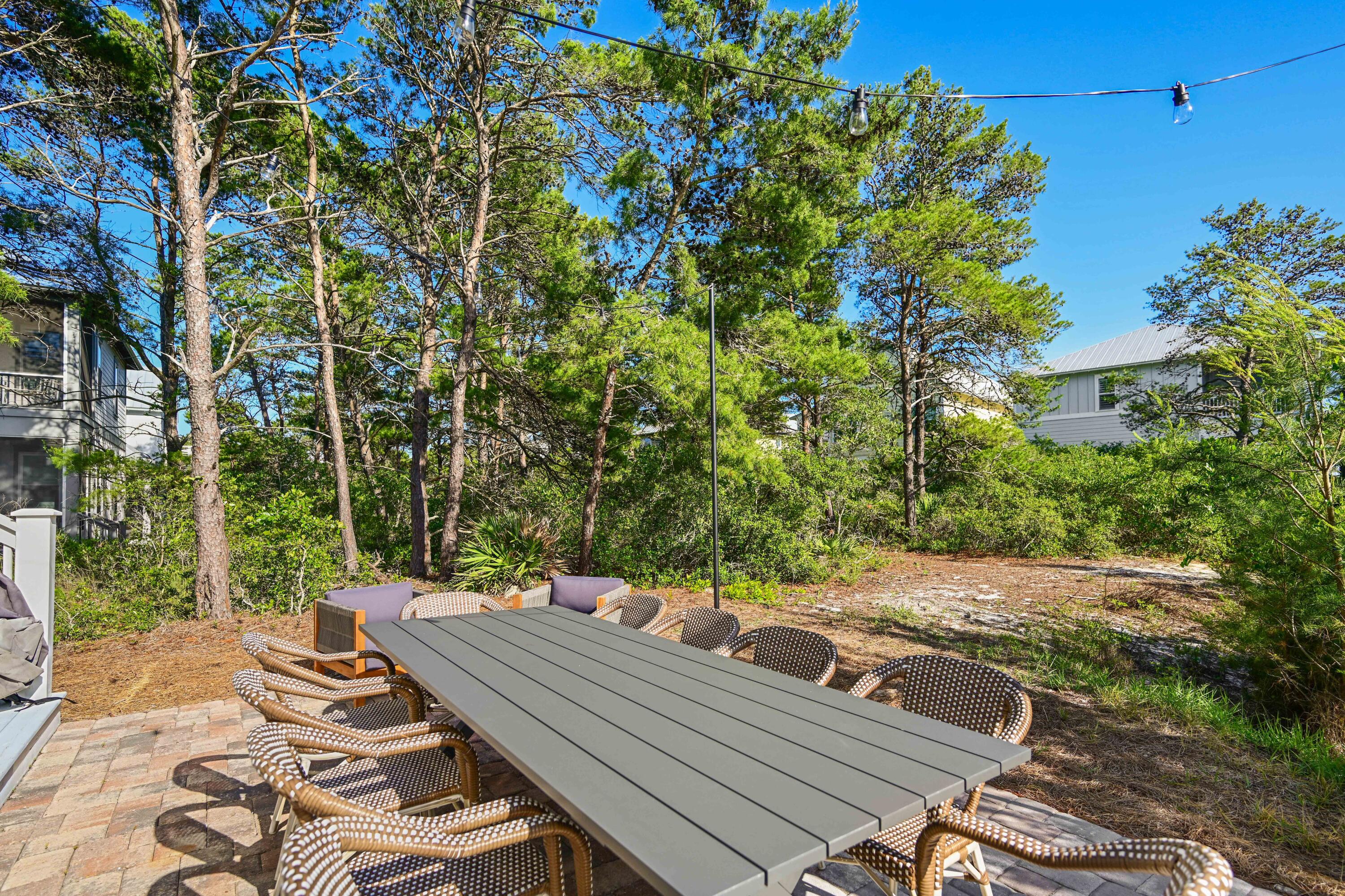 34 Gulfview Way Santa Rosa Beach, FL 32459 - Photo 29 of 54 a view of a patio with table and chairs and potted plants