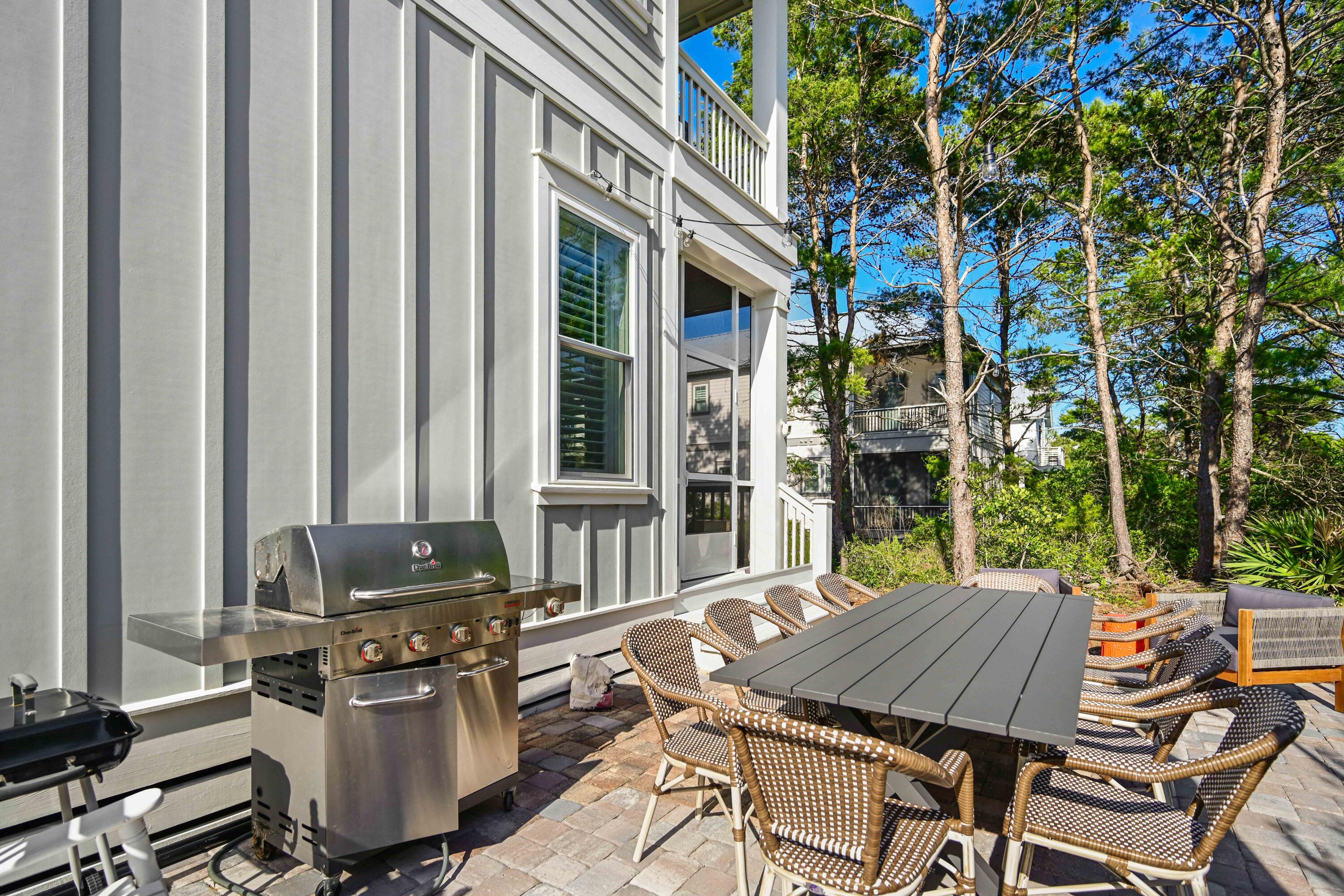 34 Gulfview Way Santa Rosa Beach, FL 32459 - Photo 30 of 54 a view of a patio with table and chairs and potted plants