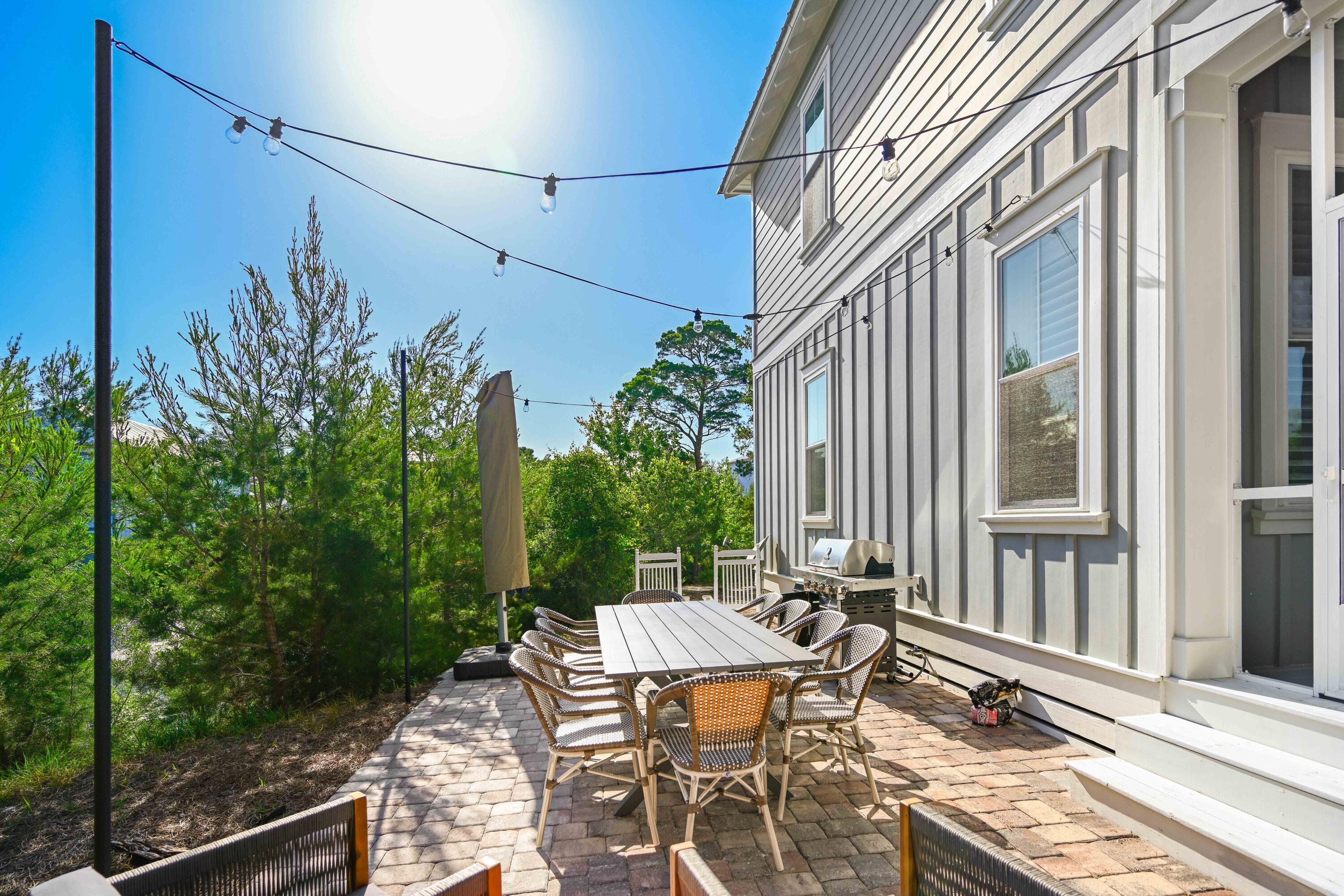 34 Gulfview Way Santa Rosa Beach, FL 32459 - Photo 31 of 54 a view of a patio with table and chairs and potted plants