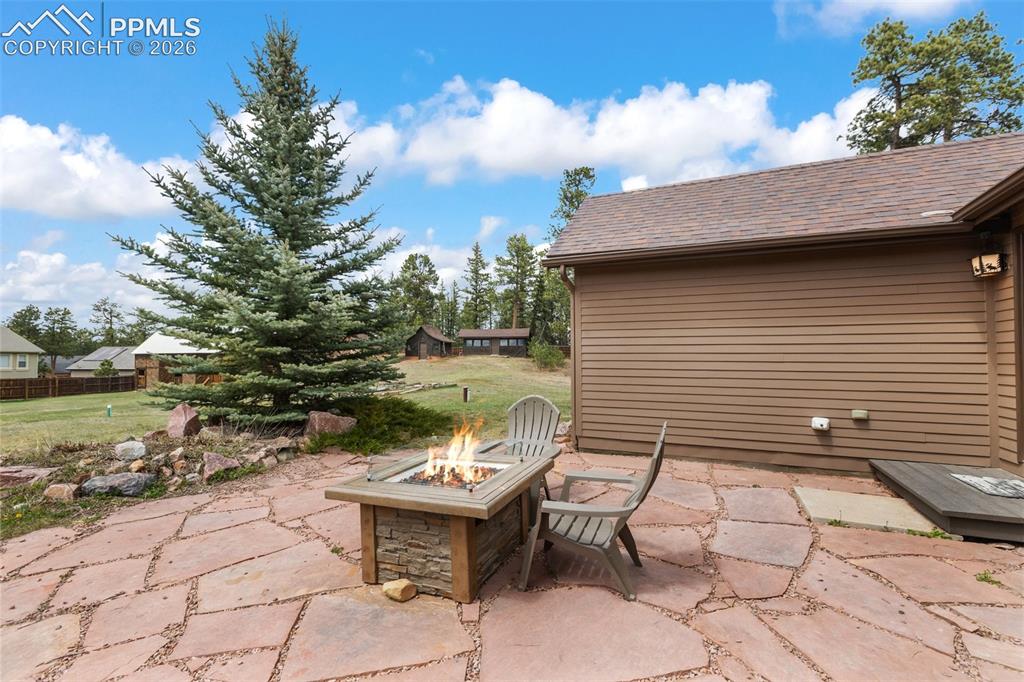 1100 Rampart Range Road Woodland Park, CO 80863 - Photo 29 of 50 Cozy up by the firepit and enjoy mountain sunsets