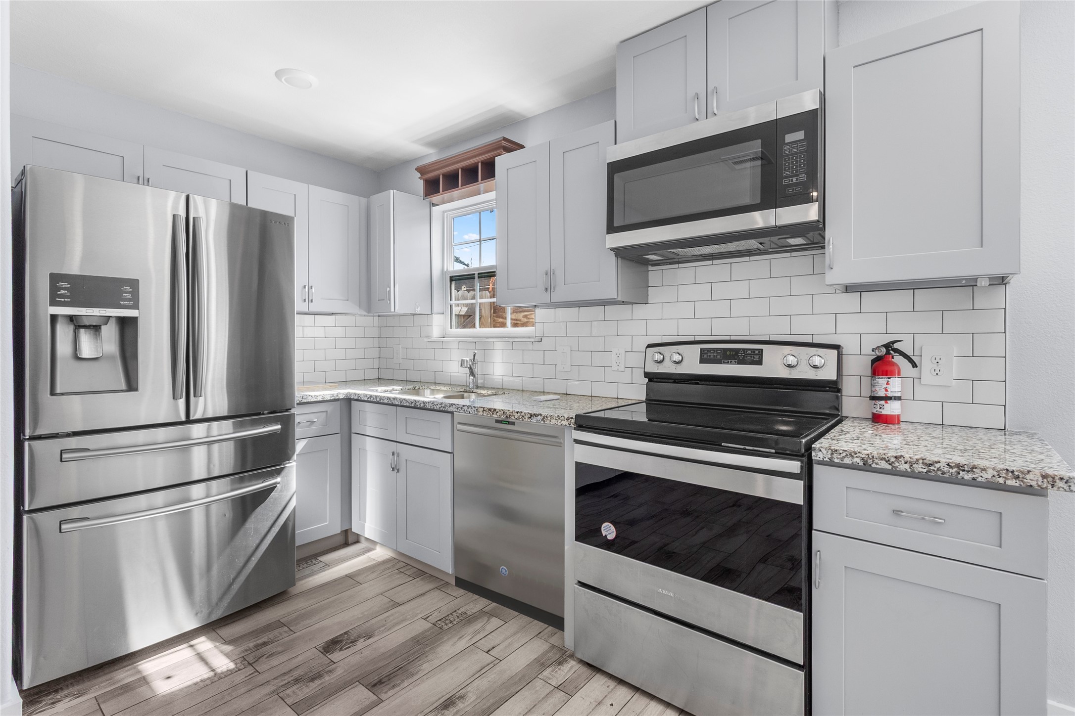6809 Glass Street, Unit A Houston, TX 77016 - Photo 5 of 20 Kitchen with all stainless steel appliances