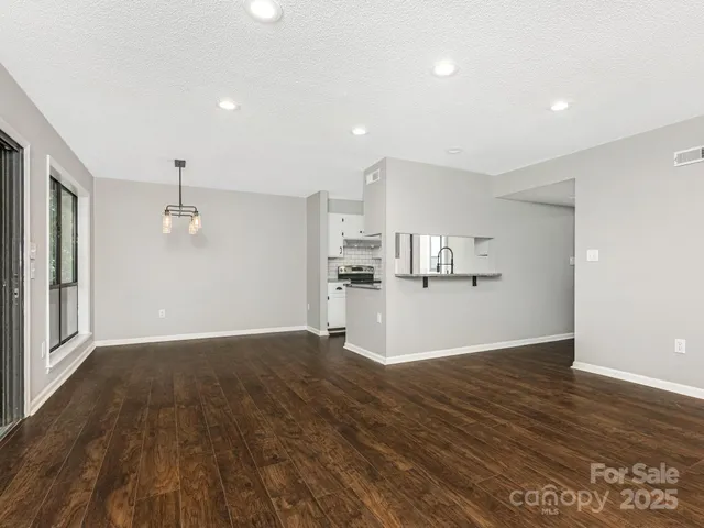 a view of kitchen with wooden floor