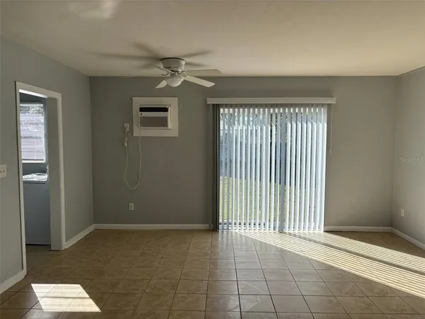 a view of an empty room with a window