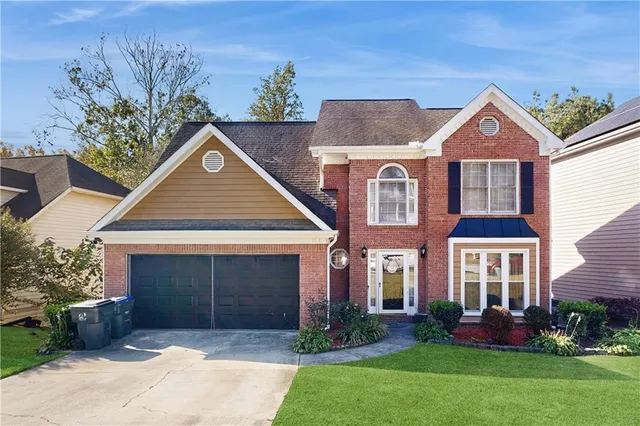 front view of a house with a yard