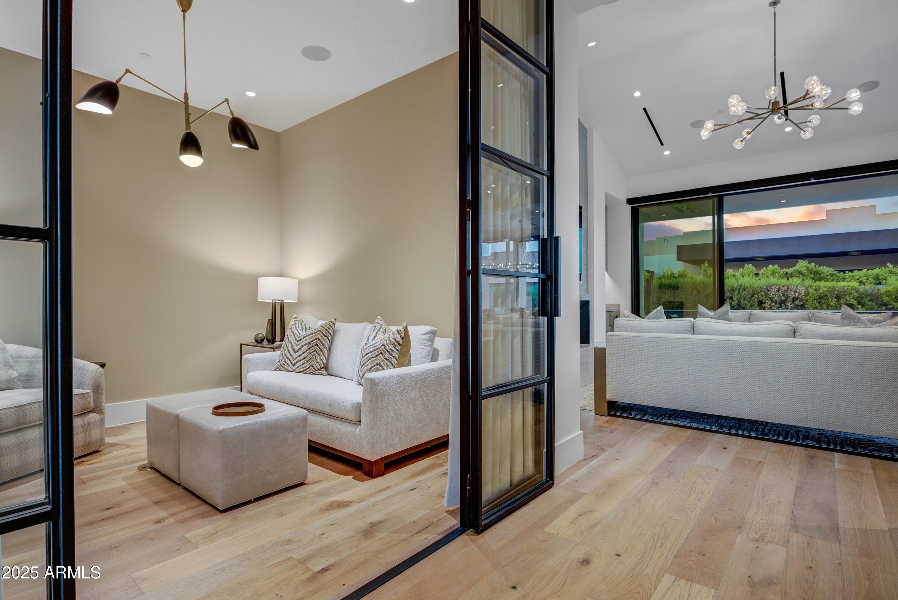 6930 East Cactus Wren Road Paradise Valley, AZ 85253 - Photo 14 of 26 a living room with furniture and a large window
