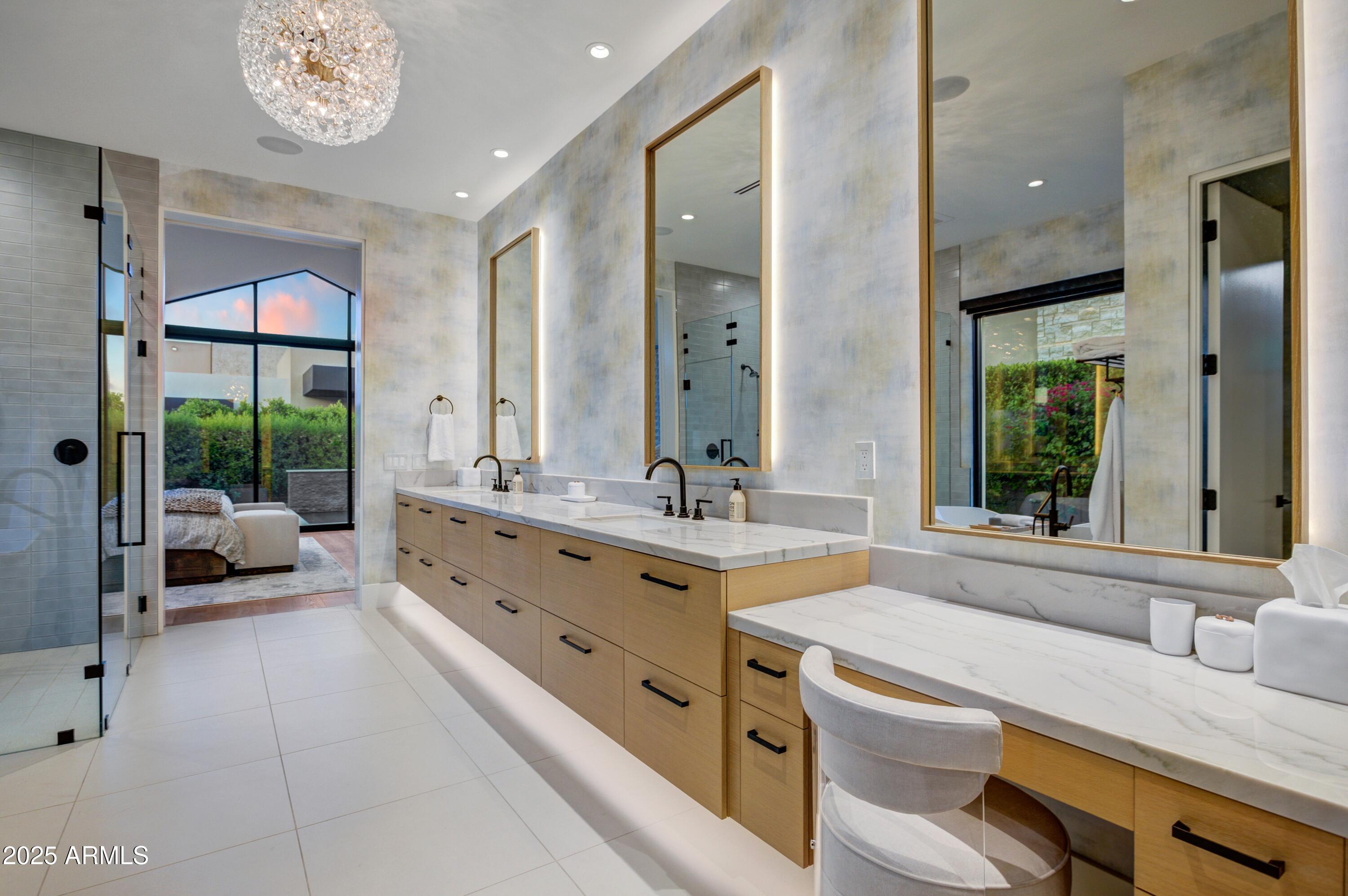 6930 East Cactus Wren Road Paradise Valley, AZ 85253 - Photo 17 of 26 a spacious bathroom with a granite countertop sink mirror and a bathtub