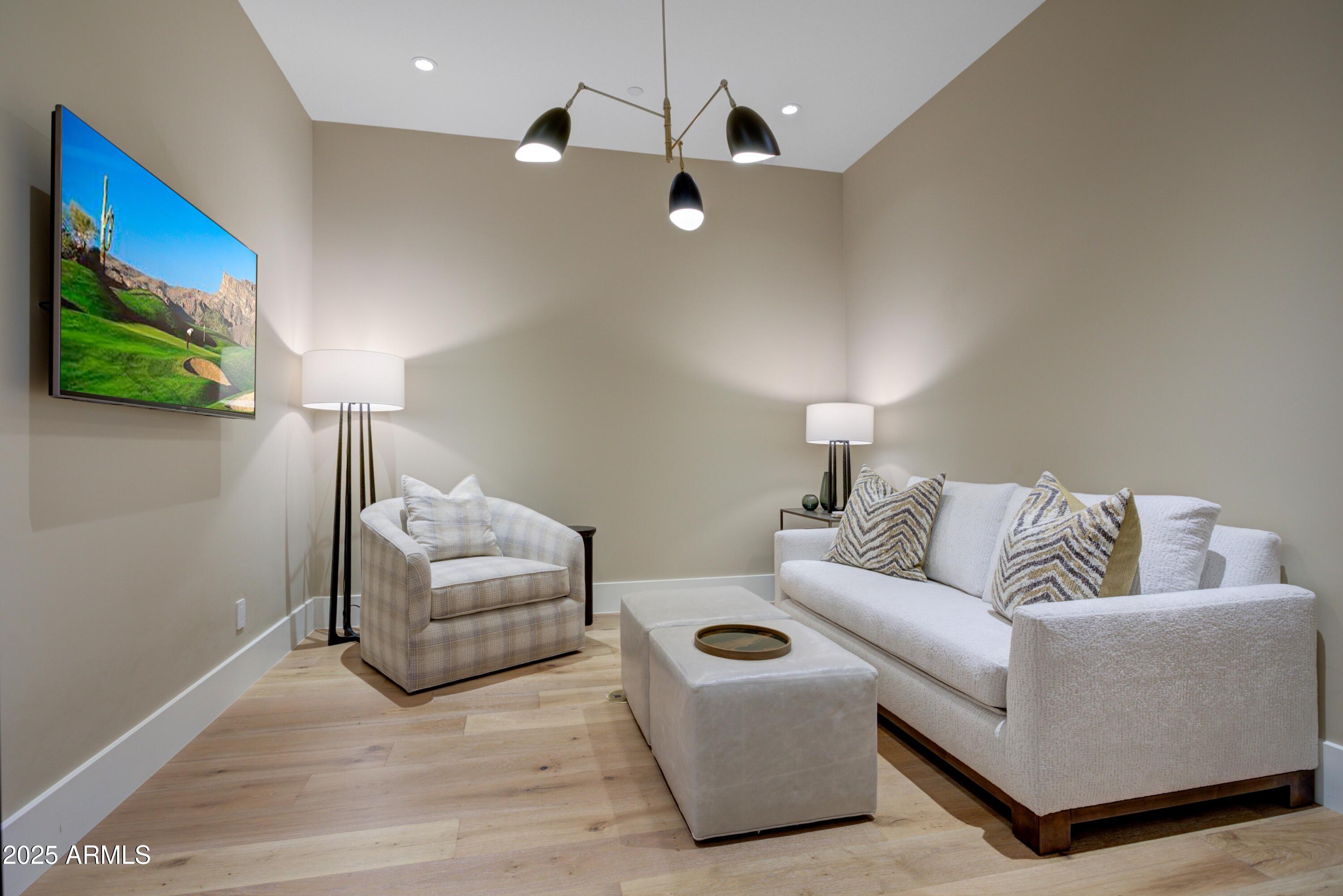 6930 East Cactus Wren Road Paradise Valley, AZ 85253 - Photo 21 of 26 a living room with furniture and a lamp