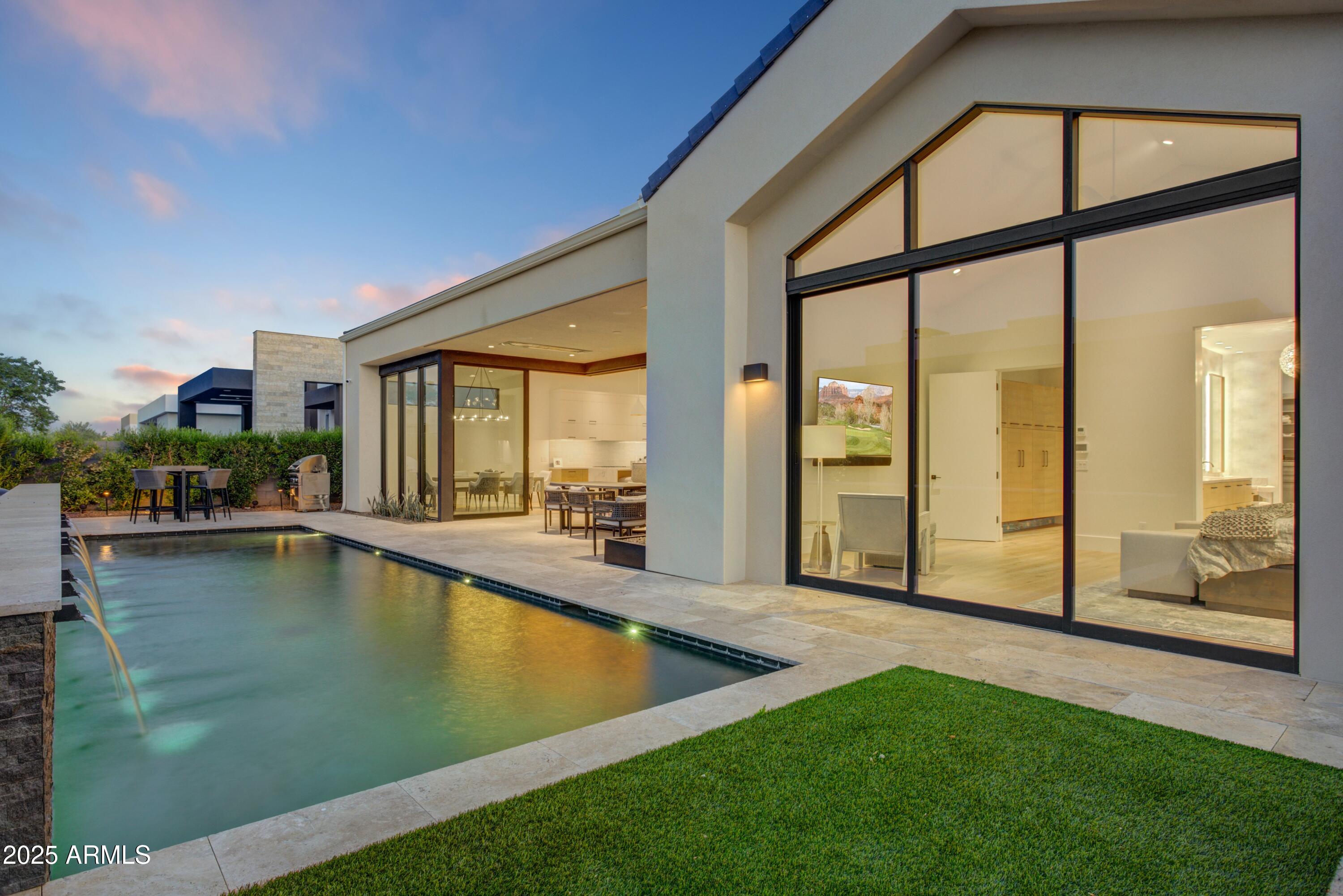 6930 East Cactus Wren Road Paradise Valley, AZ 85253 - Photo 26 of 26 a view of swimming pool with outdoor seating