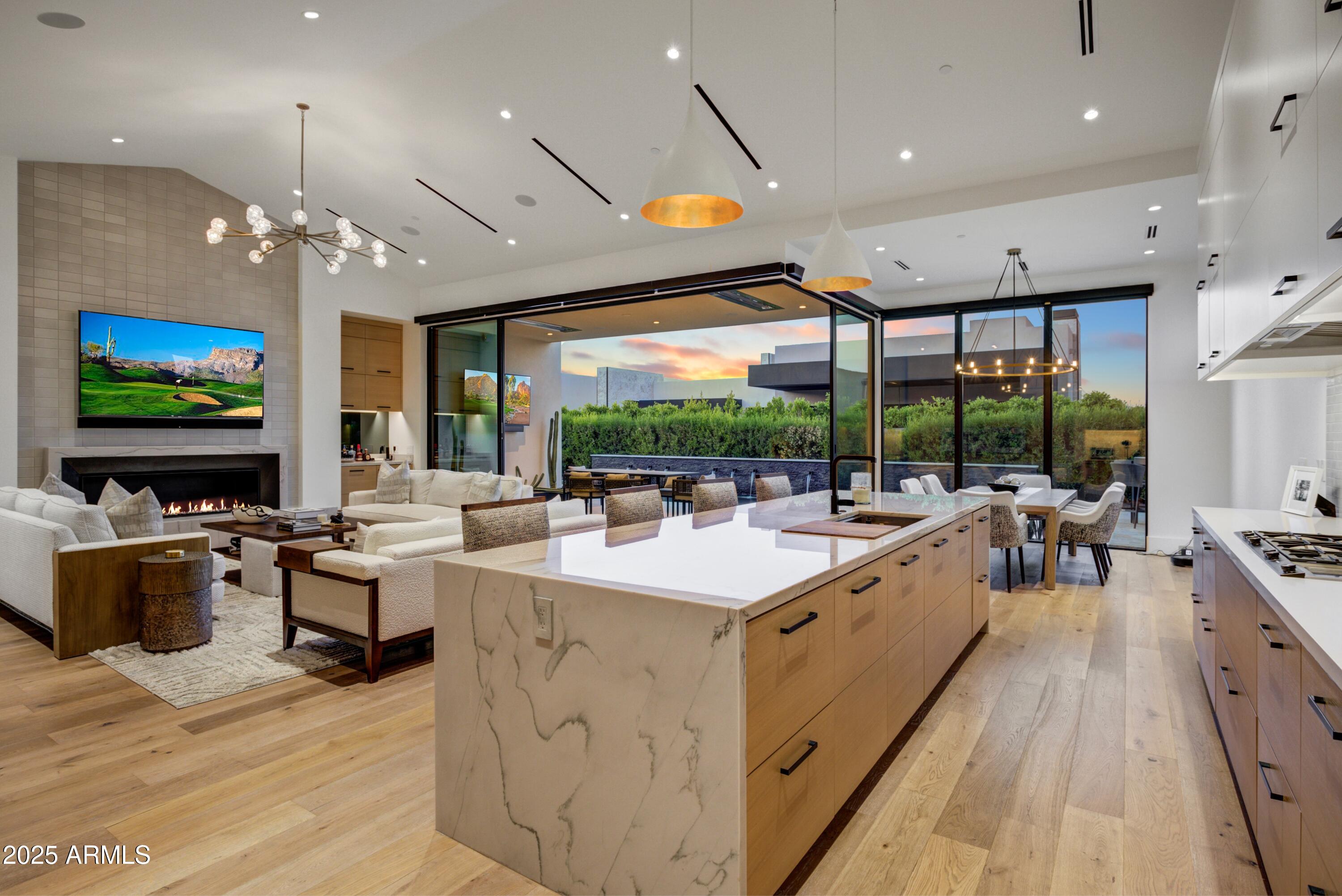 6930 East Cactus Wren Road Paradise Valley, AZ 85253 - Photo 4 of 26 a large white kitchen with a large window