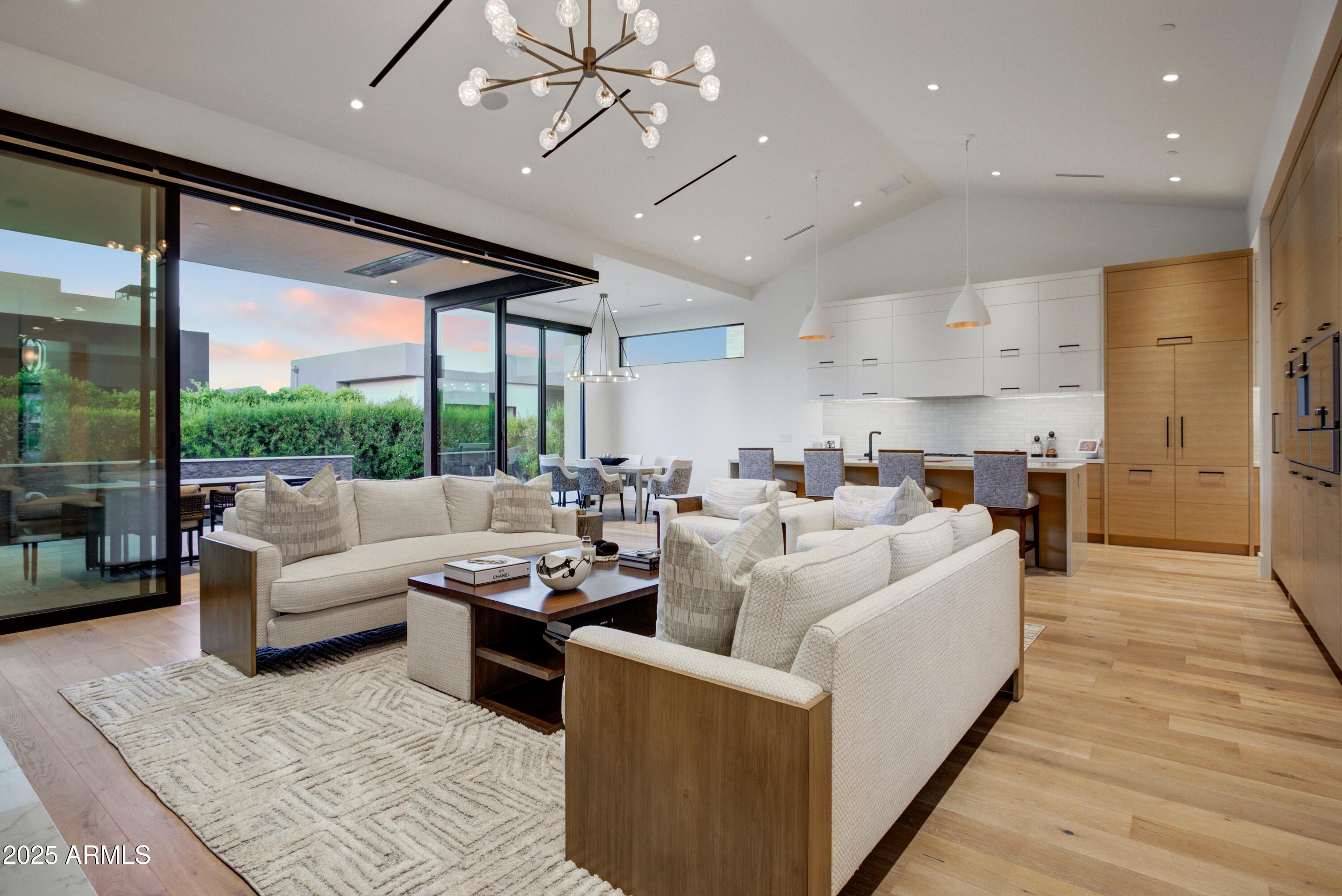 6930 East Cactus Wren Road Paradise Valley, AZ 85253 - Photo 8 of 26 a living room with furniture and a large window