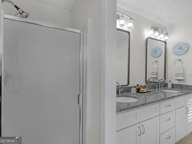 a utility room with sink dryer and washer