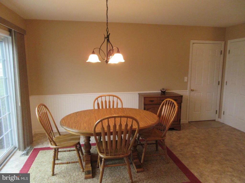 760 Wallingford Road Lititz, PA 17543 - Photo 4 of 16 a view of a dining room with furniture and chandelier