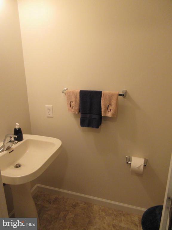 760 Wallingford Road Lititz, PA 17543 - Photo 7 of 16 a bathroom with a sink and a mirror