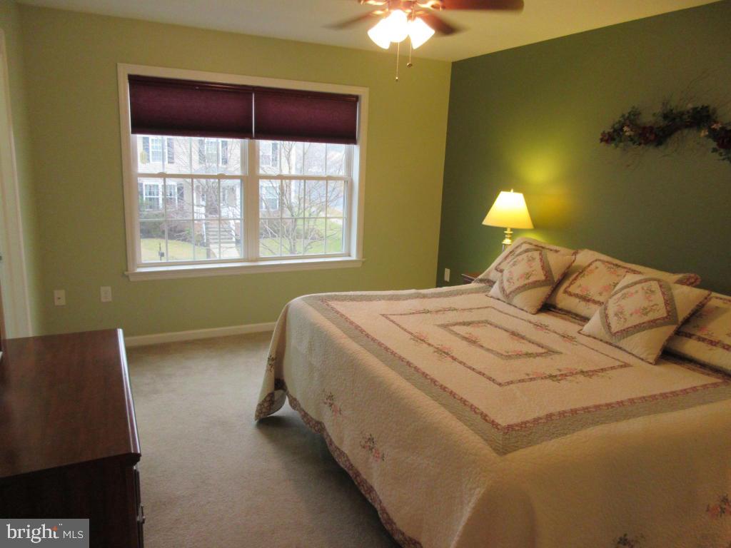 760 Wallingford Road Lititz, PA 17543 - Photo 8 of 16 a bedroom with a bed and a window