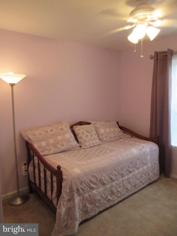 760 Wallingford Road Lititz, PA 17543 - Photo 10 of 16 a bedroom with a bed and a chandelier