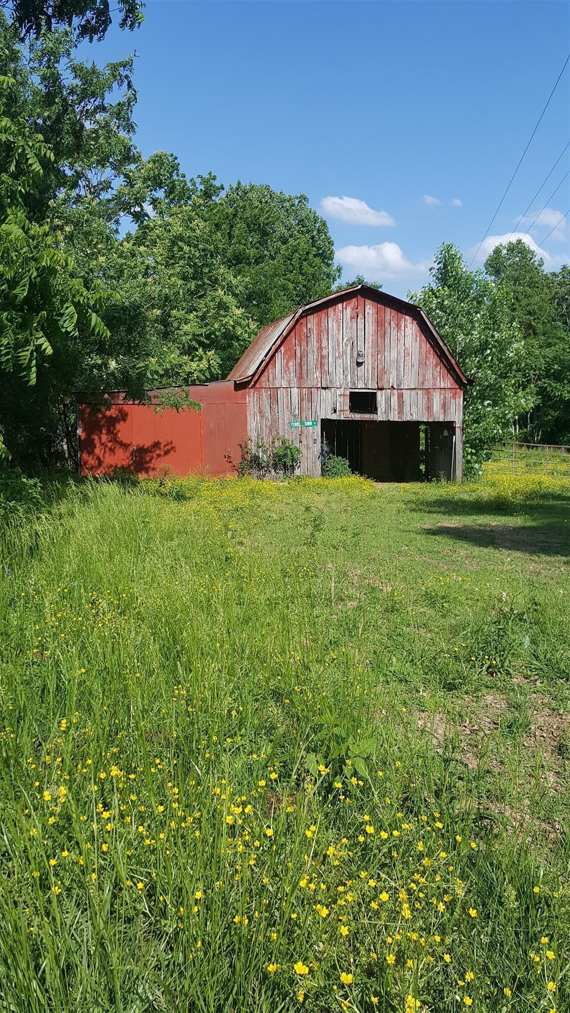 84 Pea Ridge Road Woodbury, TN 37190 - Photo 1 of 2 a backyard of a house with lots of green space