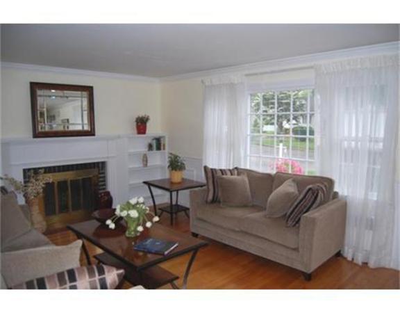 27 Cherokee Road Arlington, MA 02474 - Photo 4 of 19 a living room with furniture and a fireplace