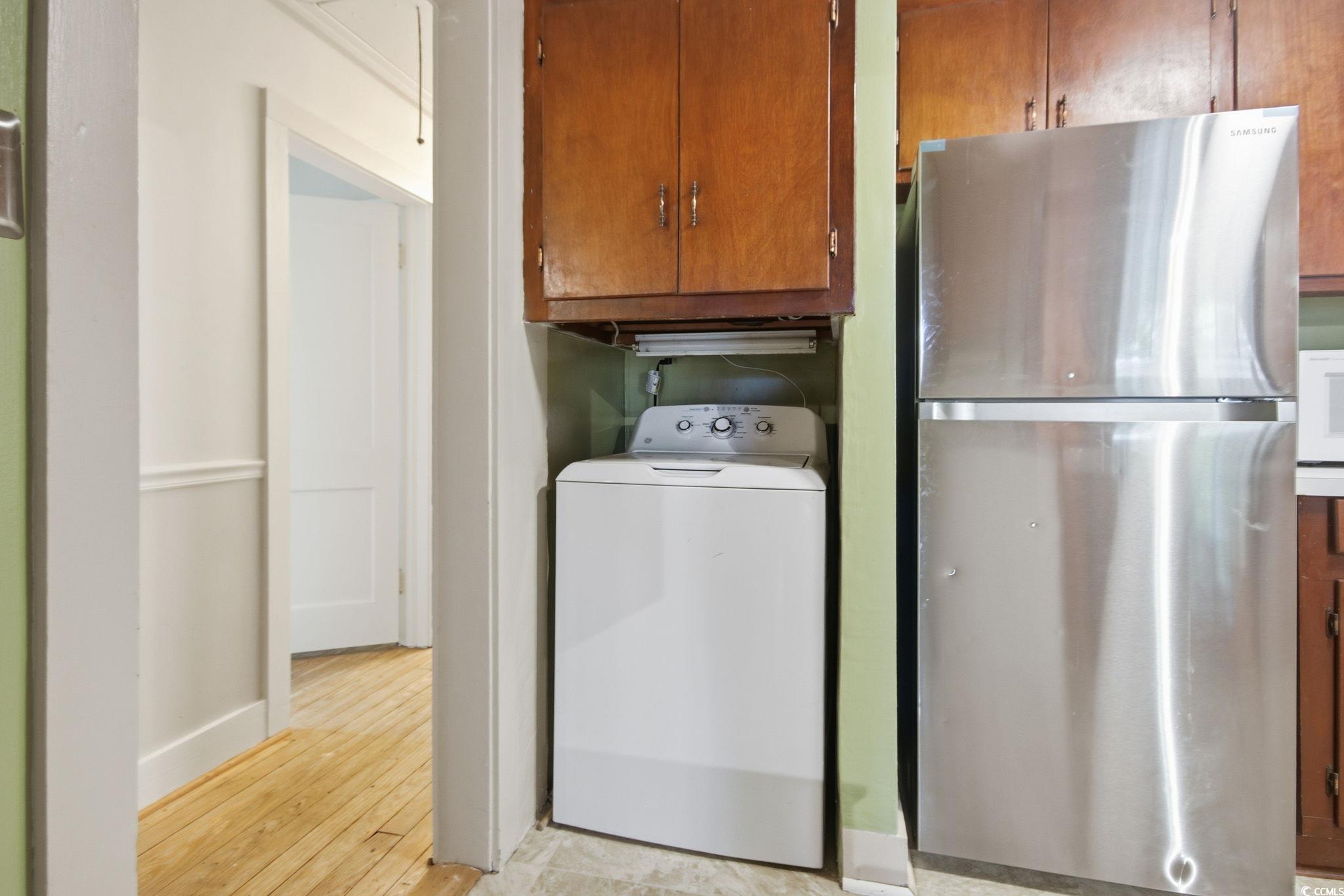 2206 Beck Street Georgetown, SC 29440 - Photo 11 of 36 Laundry room with washer / dryer and light wood-type flooring