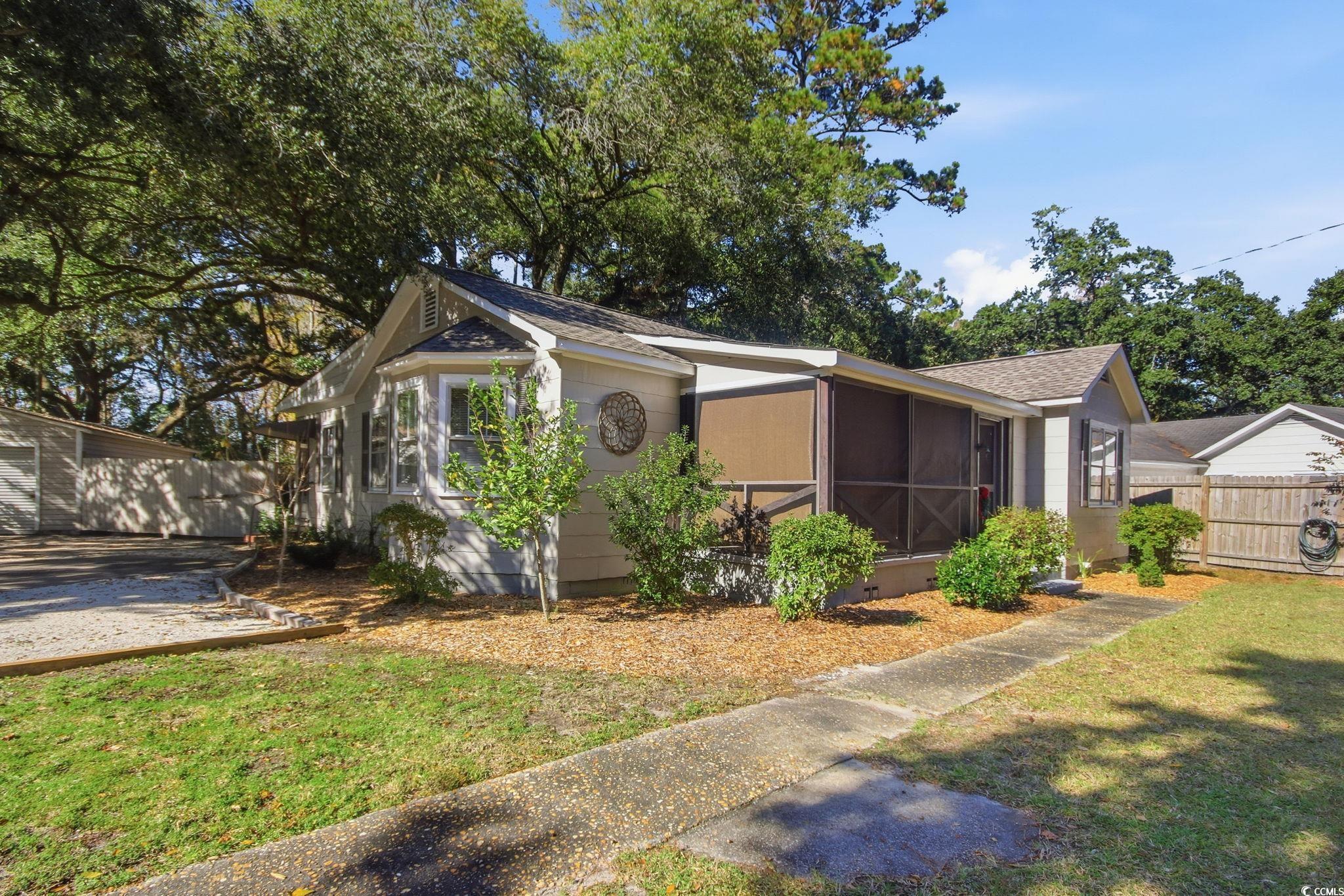 2206 Beck Street Georgetown, SC 29440 - Photo 2 of 36 View of front of house with a sunroom and roof with shingles
