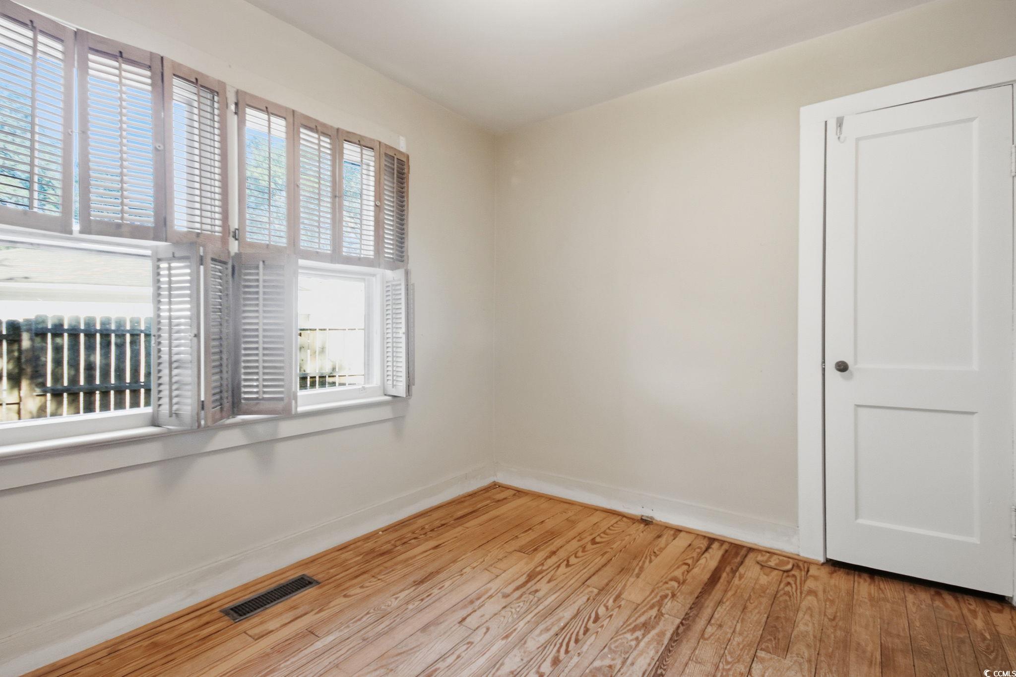 2206 Beck Street Georgetown, SC 29440 - Photo 23 of 36 Empty room with light wood-style floors and baseboards