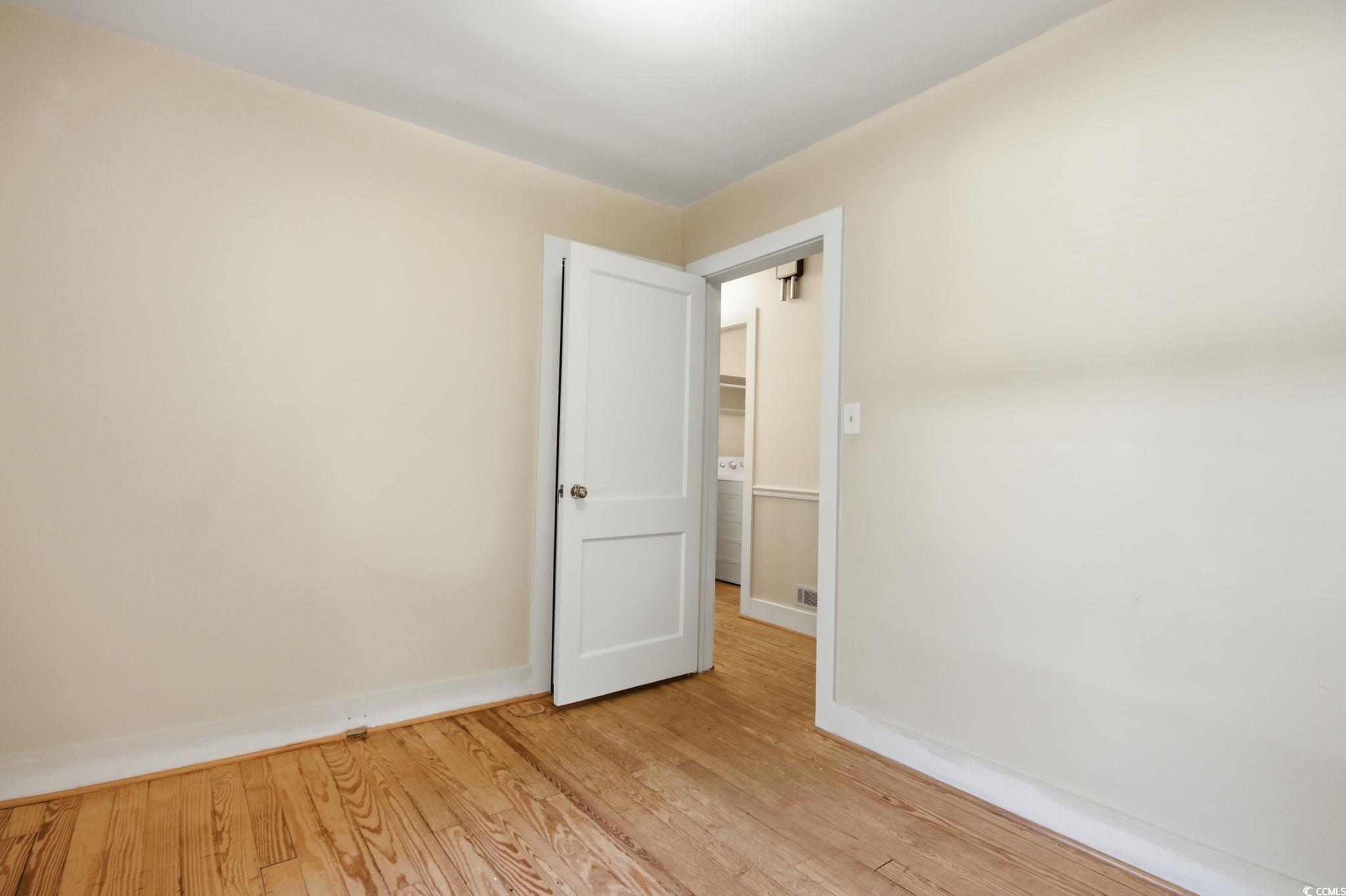 2206 Beck Street Georgetown, SC 29440 - Photo 24 of 36 Empty room featuring light wood-style flooring and baseboards