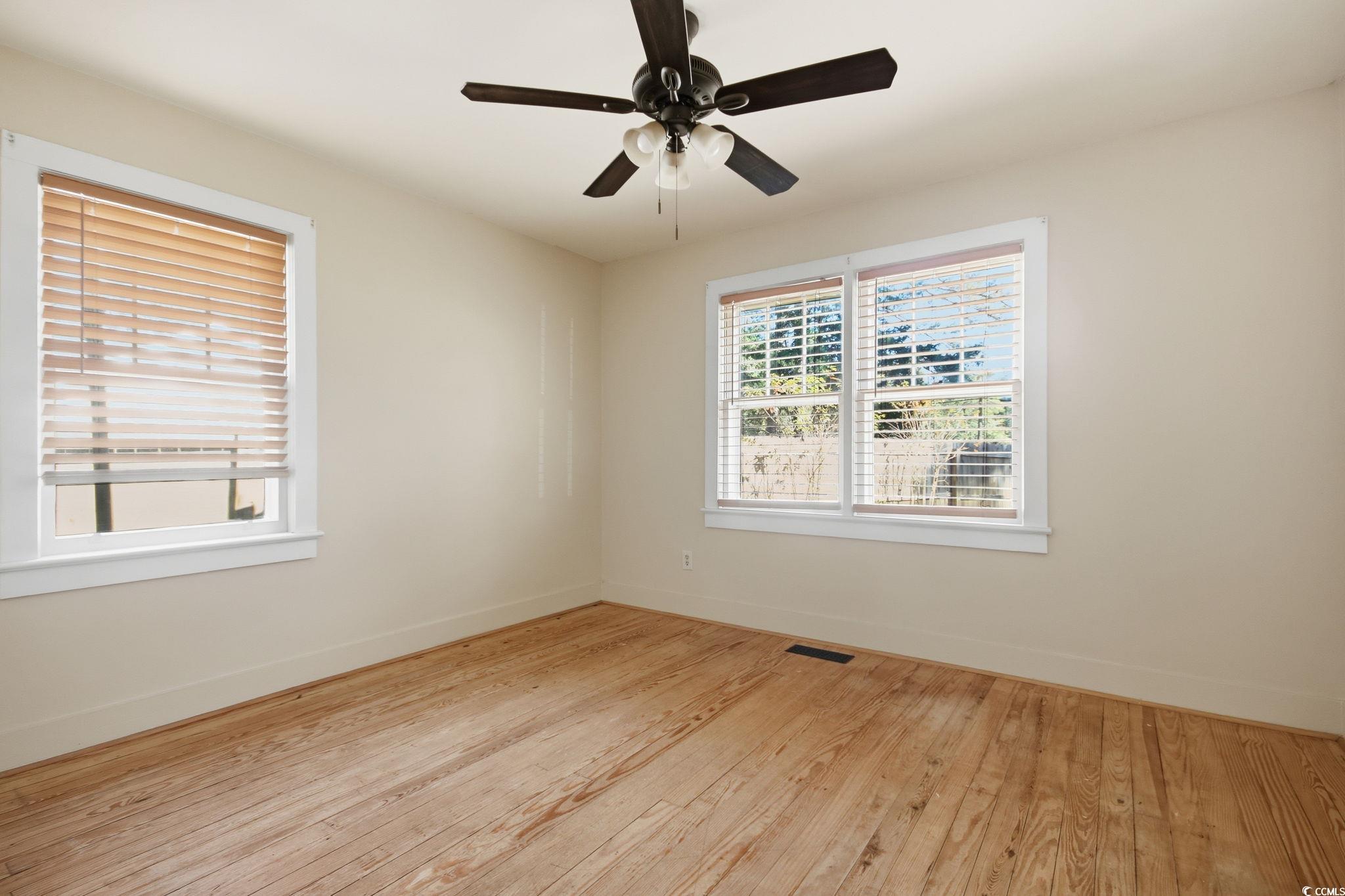 2206 Beck Street Georgetown, SC 29440 - Photo 27 of 36 Unfurnished room featuring light wood finished floors and ceiling fan